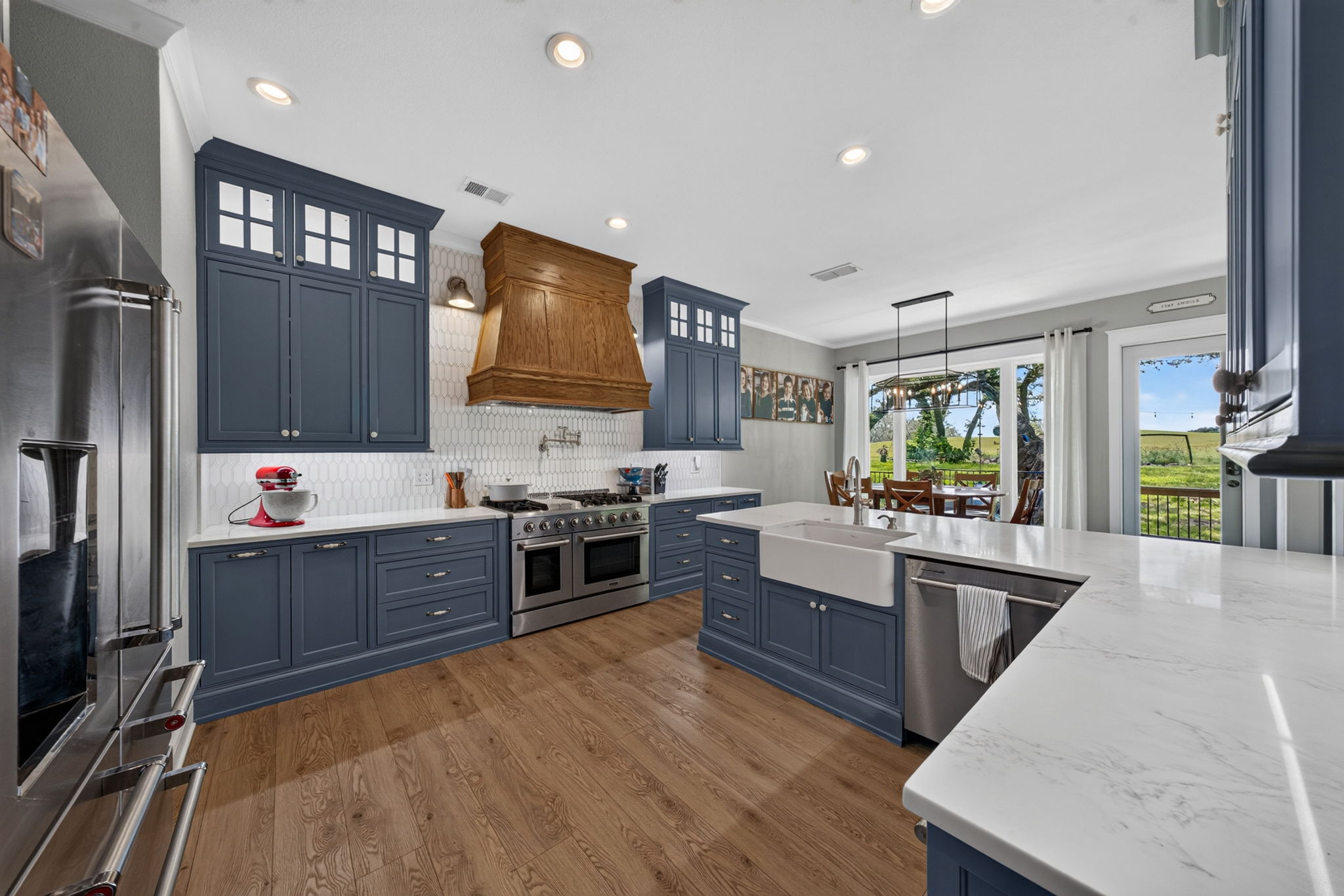 29607 Fairway Bluff Dr Boerne TX custom blue cabinetry shiplap tile fireplace luxury wood vinyl floors Fair Oaks Ranch interior