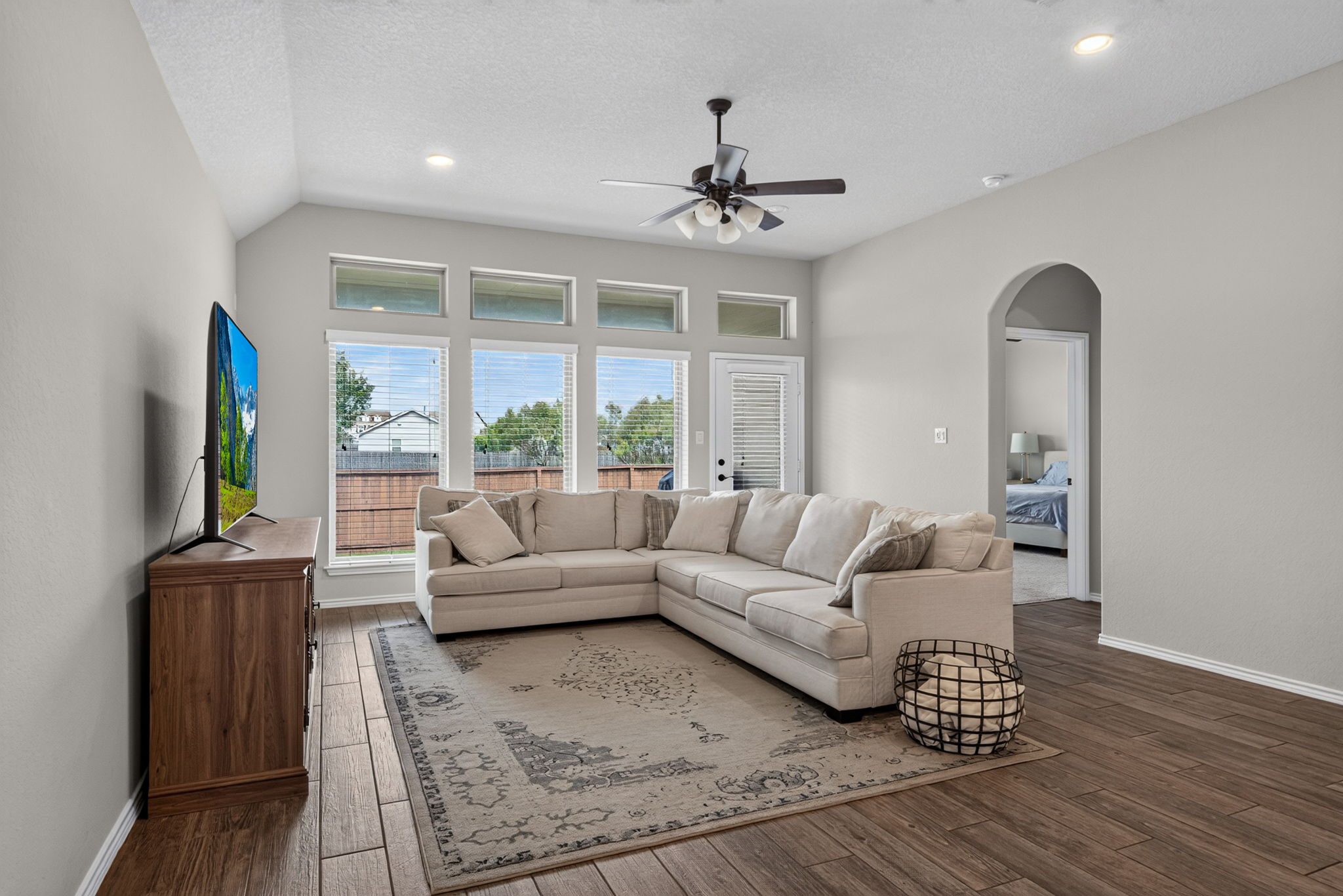 8455 Flint Meadows San Antonio TX open concept living granite kitchen island soaring ceilings Perry Home Kallison Ranch interior