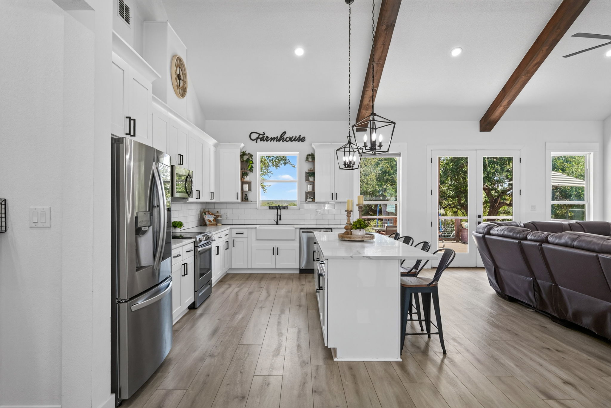 335 Saddle Mountain Dr Boerne TX open floor plan high ceilings island kitchen living room fireplace The Crossing at Hidden Lake interior