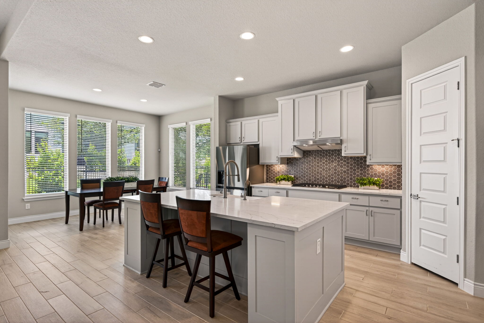 477 Vamanos Boerne TX quartz island kitchen soaring ceilings open concept single-story Monticello Esperanza interior