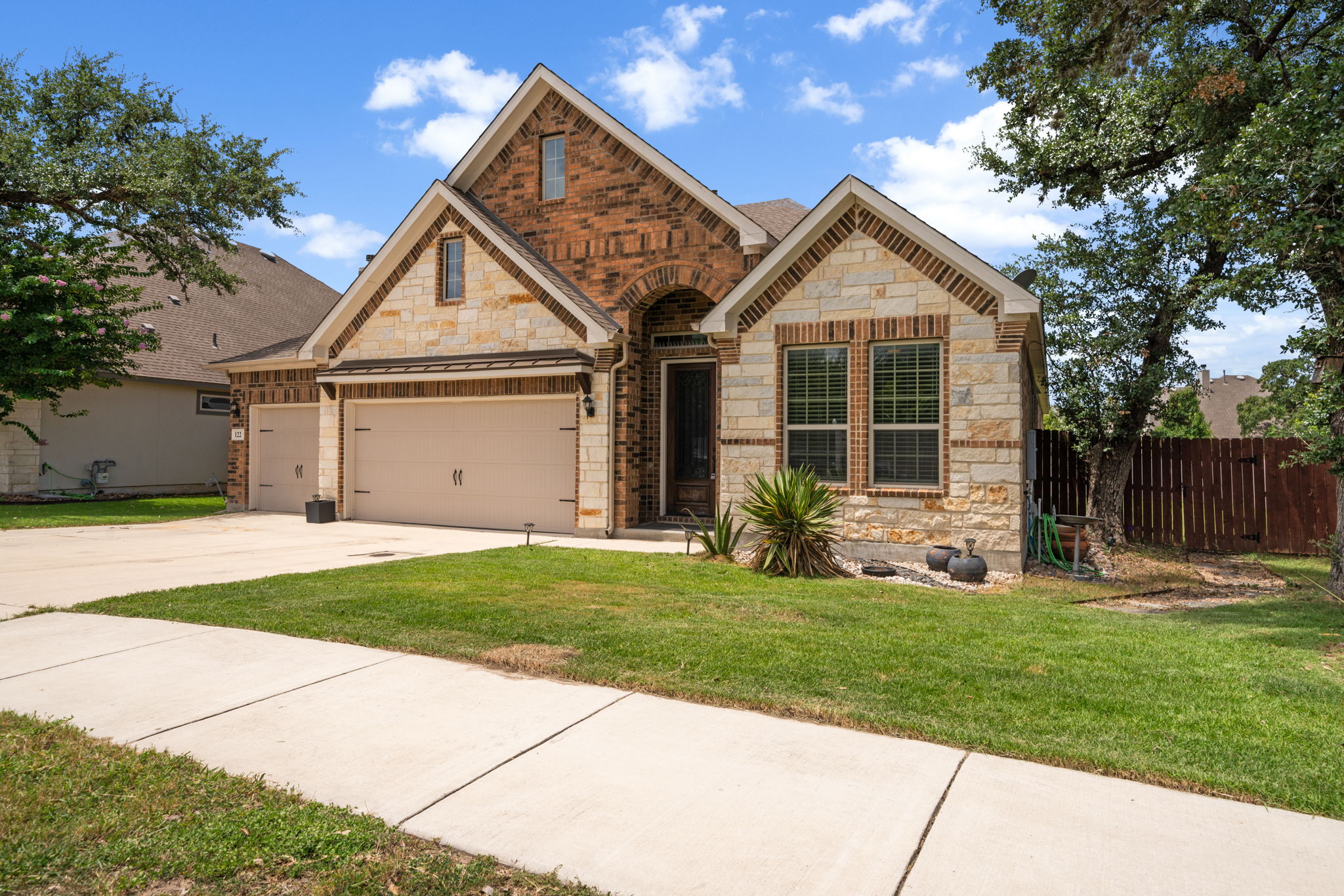 122 Noble Woods Boerne TX 78006 The Woods of Boerne gated community single-story Ashton Woods greenbelt featured by Rise Property Group