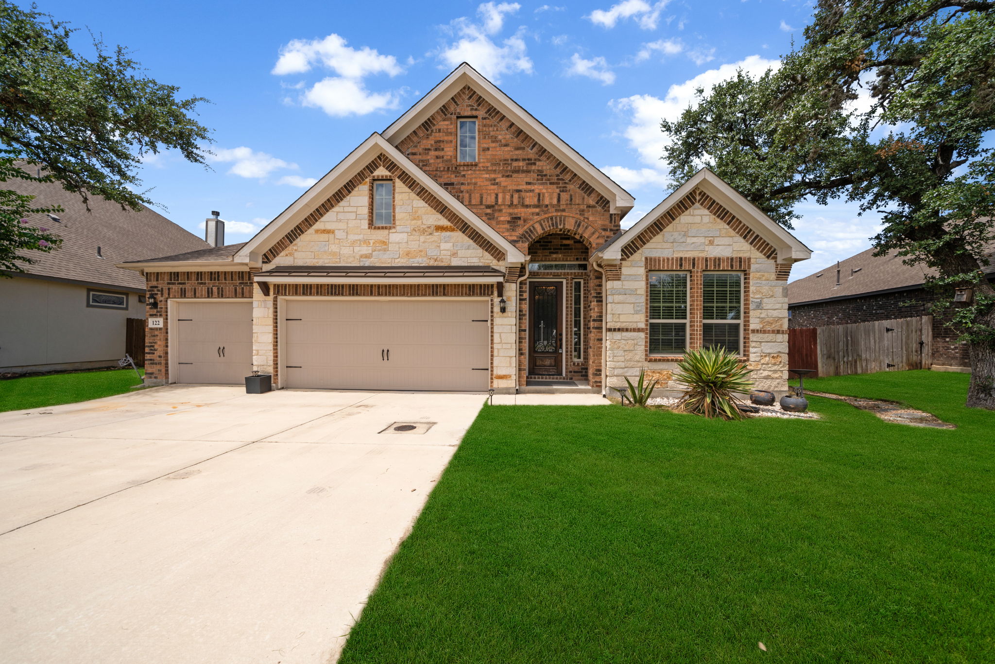 Featured Listing: 122 Noble Woods, Boerne TX 78006 – Exquisitely Upgraded Single-Story Living Backing to Greenbelt in The Woods of Boerne header image.