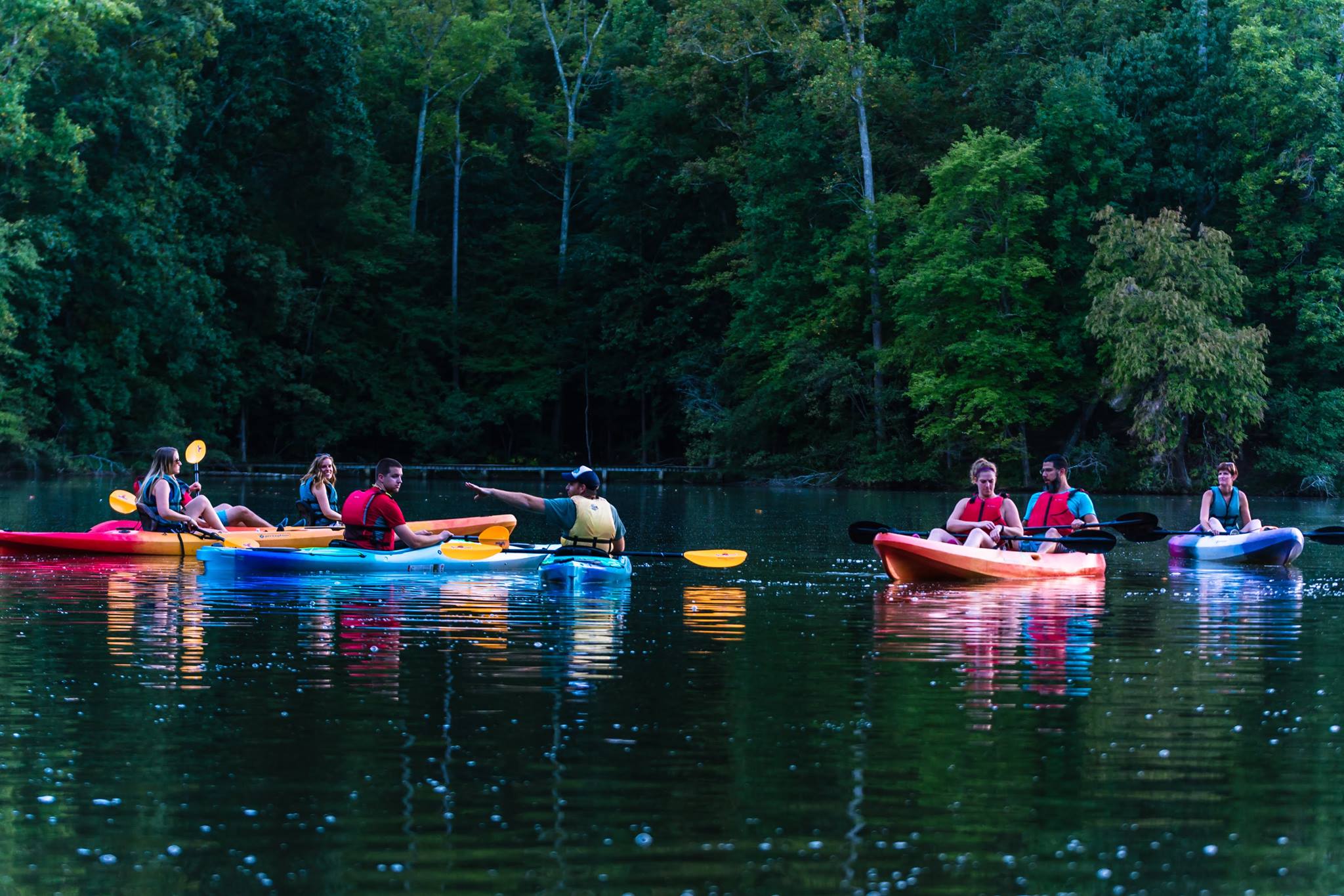 Kayakers on a calm lake at Anne Springs Close Greenway.