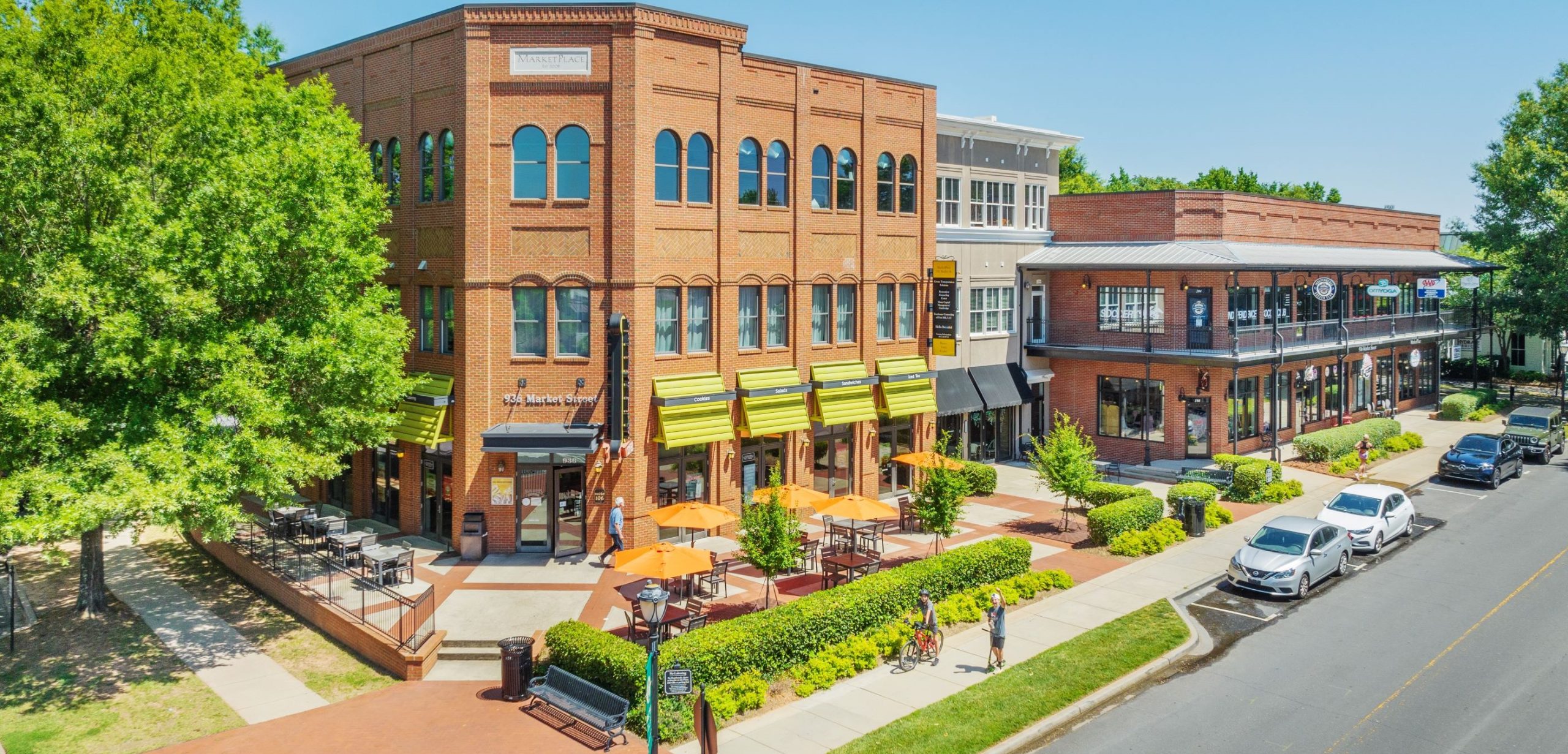 Baxter Town Center from above showing shops, sidewalks, and parked cars.