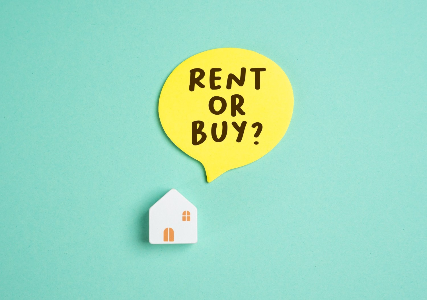 Small model of house with a speech bubble above with text 'rent or buy?'