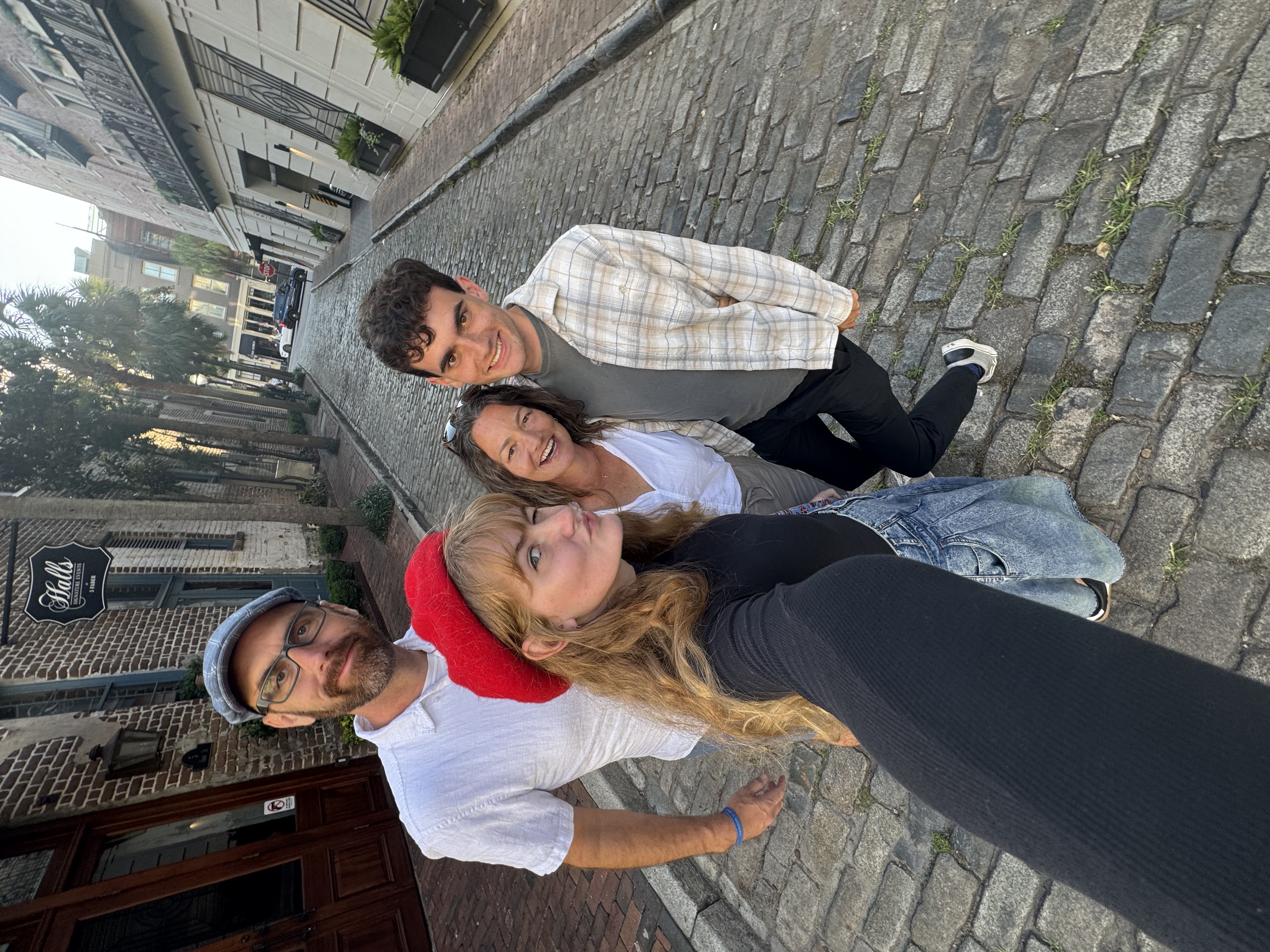 Family on cobblestone street in Charleston, SC