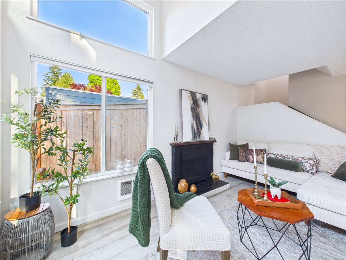 Bright, professionally staged living room in a Seattle WA home for sale with modern décor and natural light – presented by the best real estate agent near me, specializing in Tacoma real estate and top-rated Realtors in the Puget Sound area.