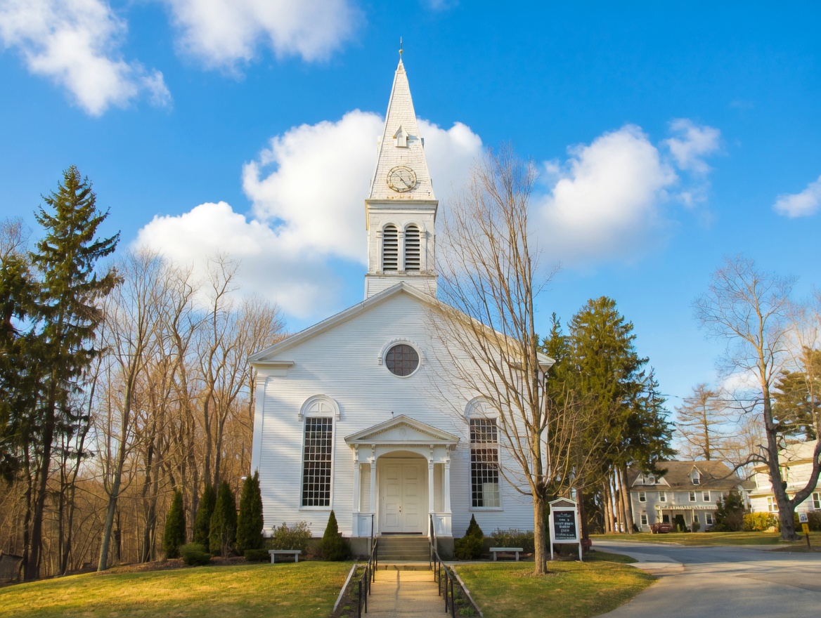Historic Community Congregational Church in Greenland NH town center with classic New England architecture and tree-lined setting