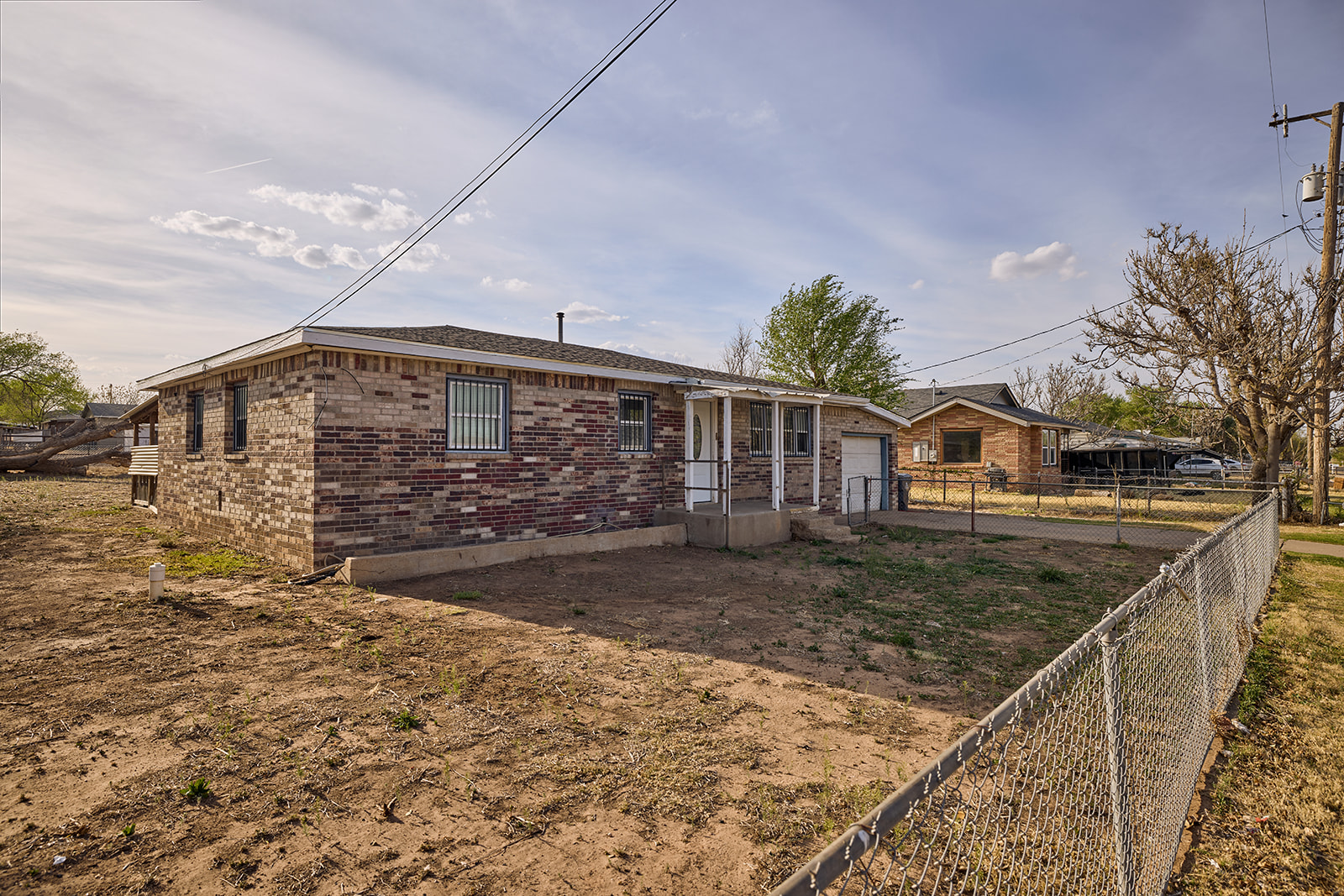 “Front exterior of 14811 Morning Dr Amarillo TX home with open landscape”