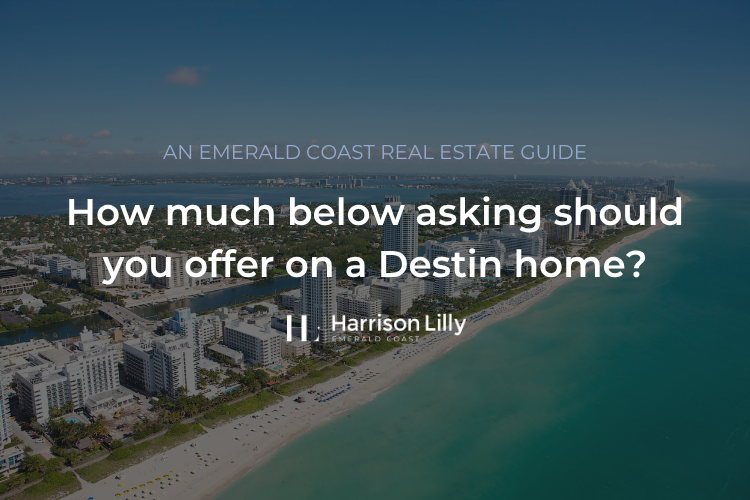 buyer at a kitchen table reviewing an offer with a listing sheet for a Destin beach house