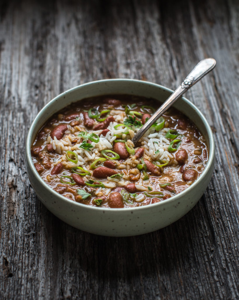 Bowl of red beans and rice with green onions