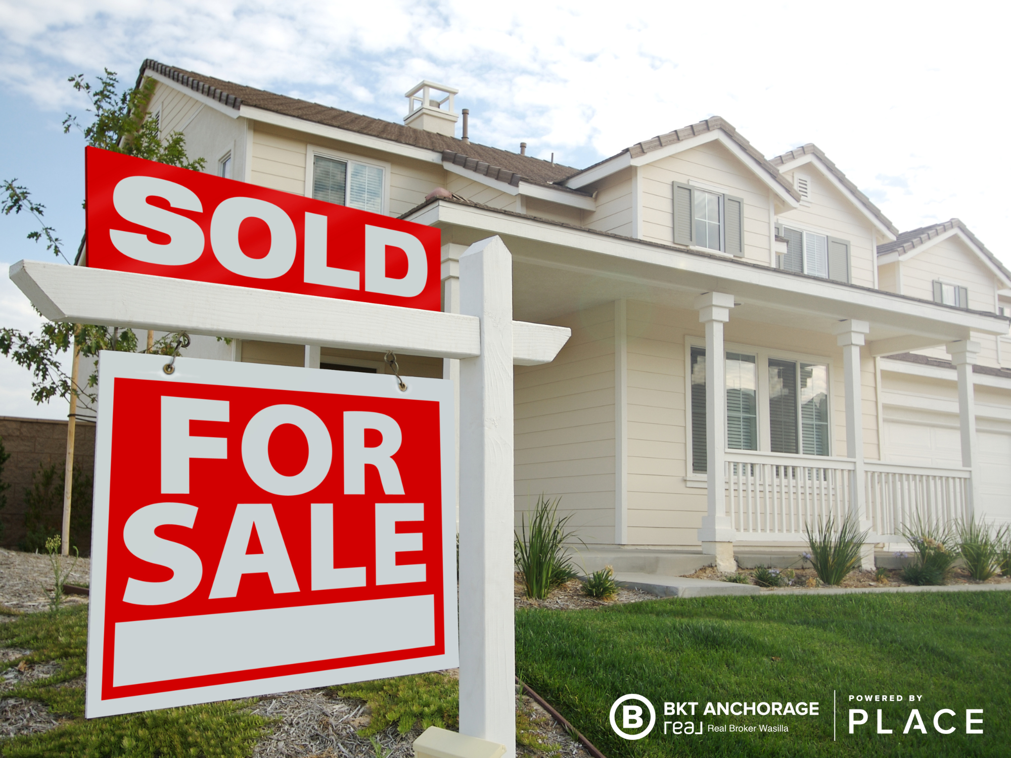 picture of a home with a for sale sign in front of it