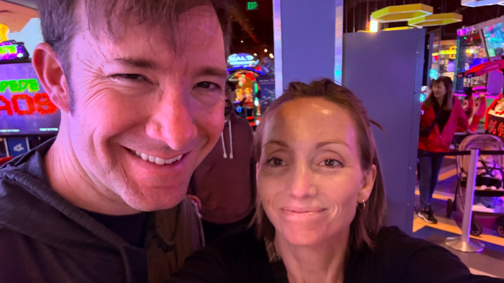 Victoria merchant and her husband taking a selfie at a laser tag arcade