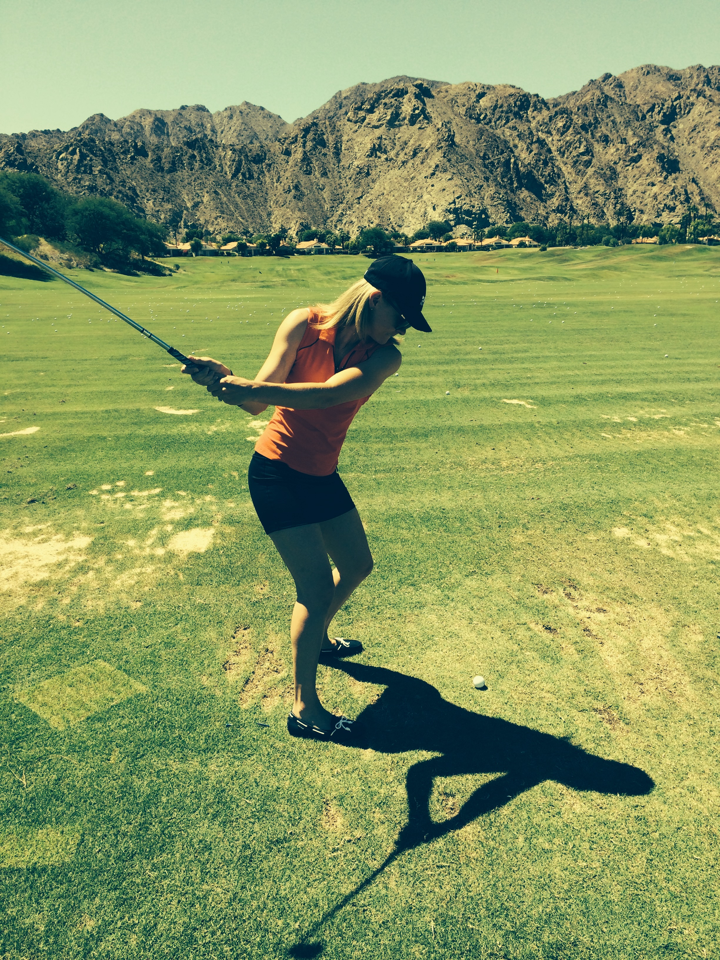 Girl swinging golf club at PGA West