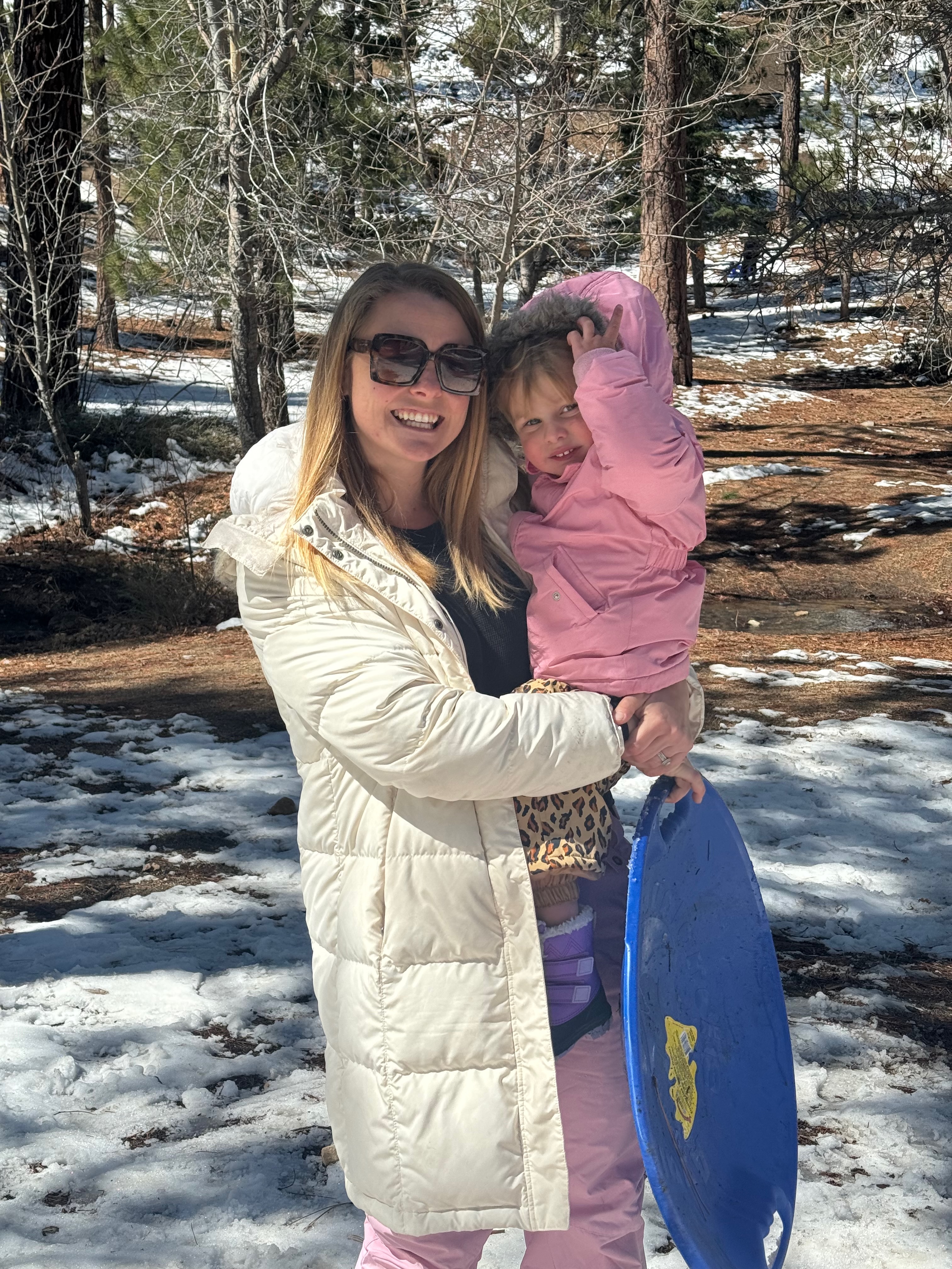 Mom and toddler with light snow in Big Bear
