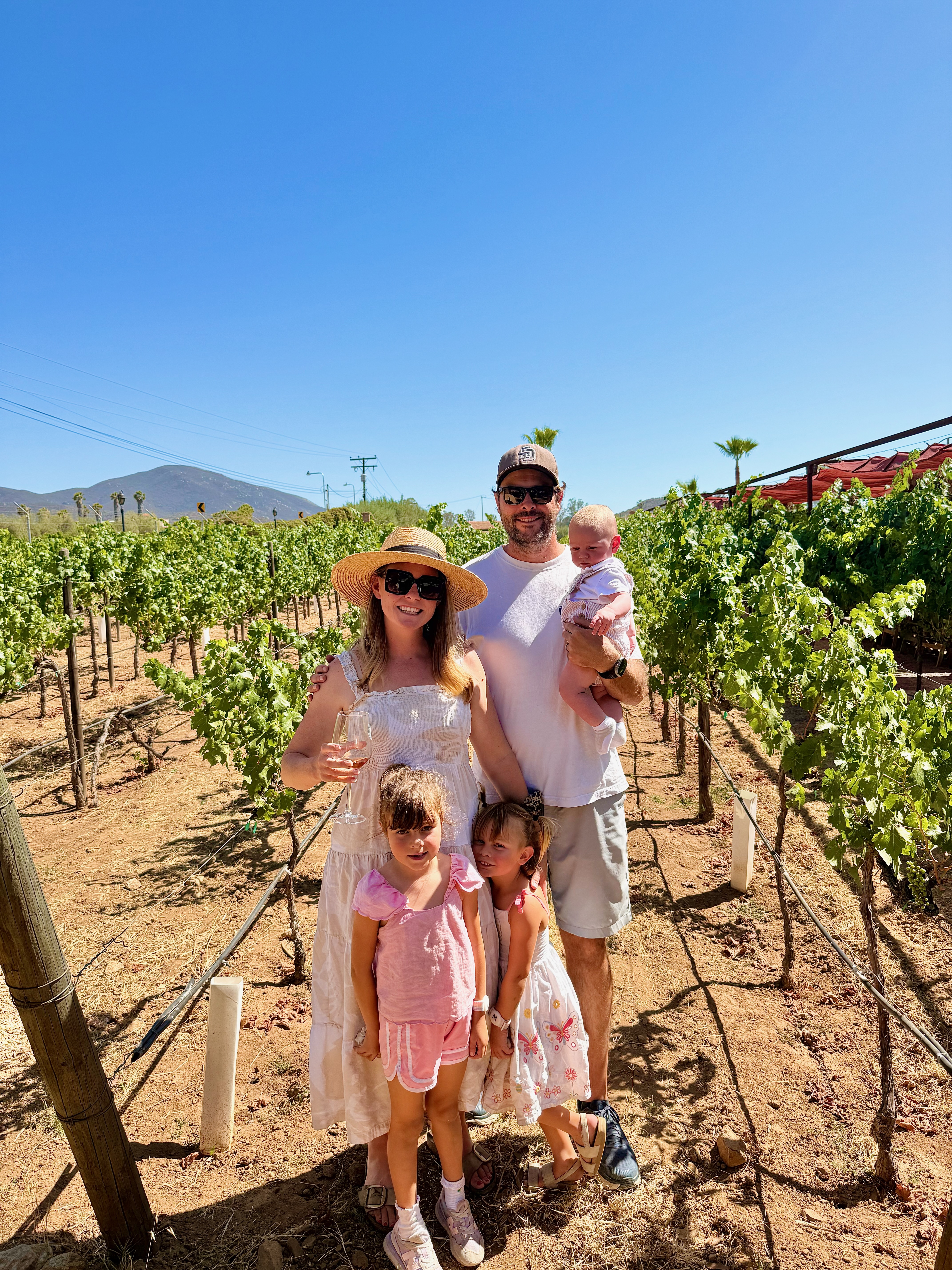 Family with 2 kids and a baby at Lechuza Winery in Valle de Guadalupe