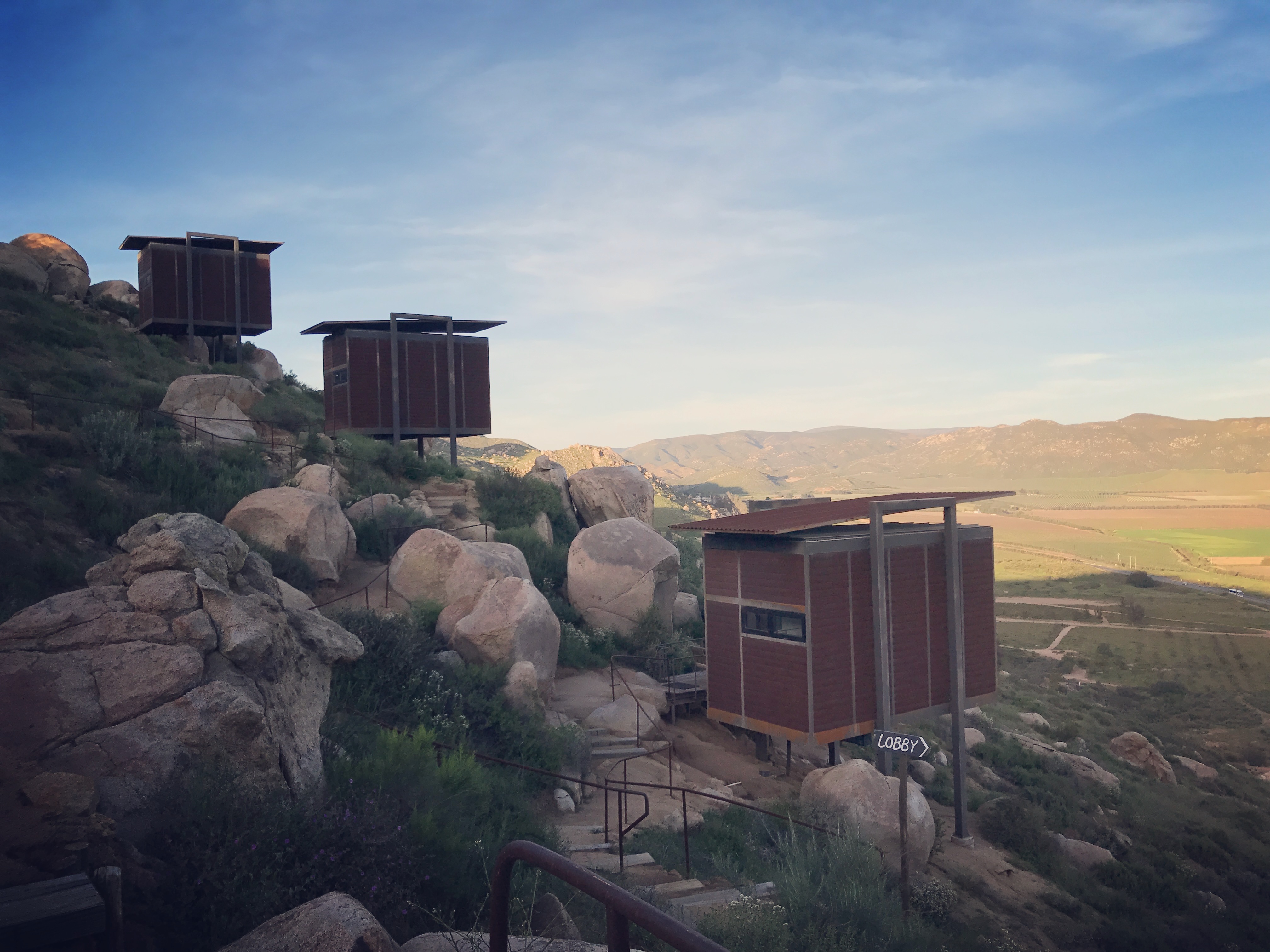 Cabins against the hillside at Encuentro Guadalupe