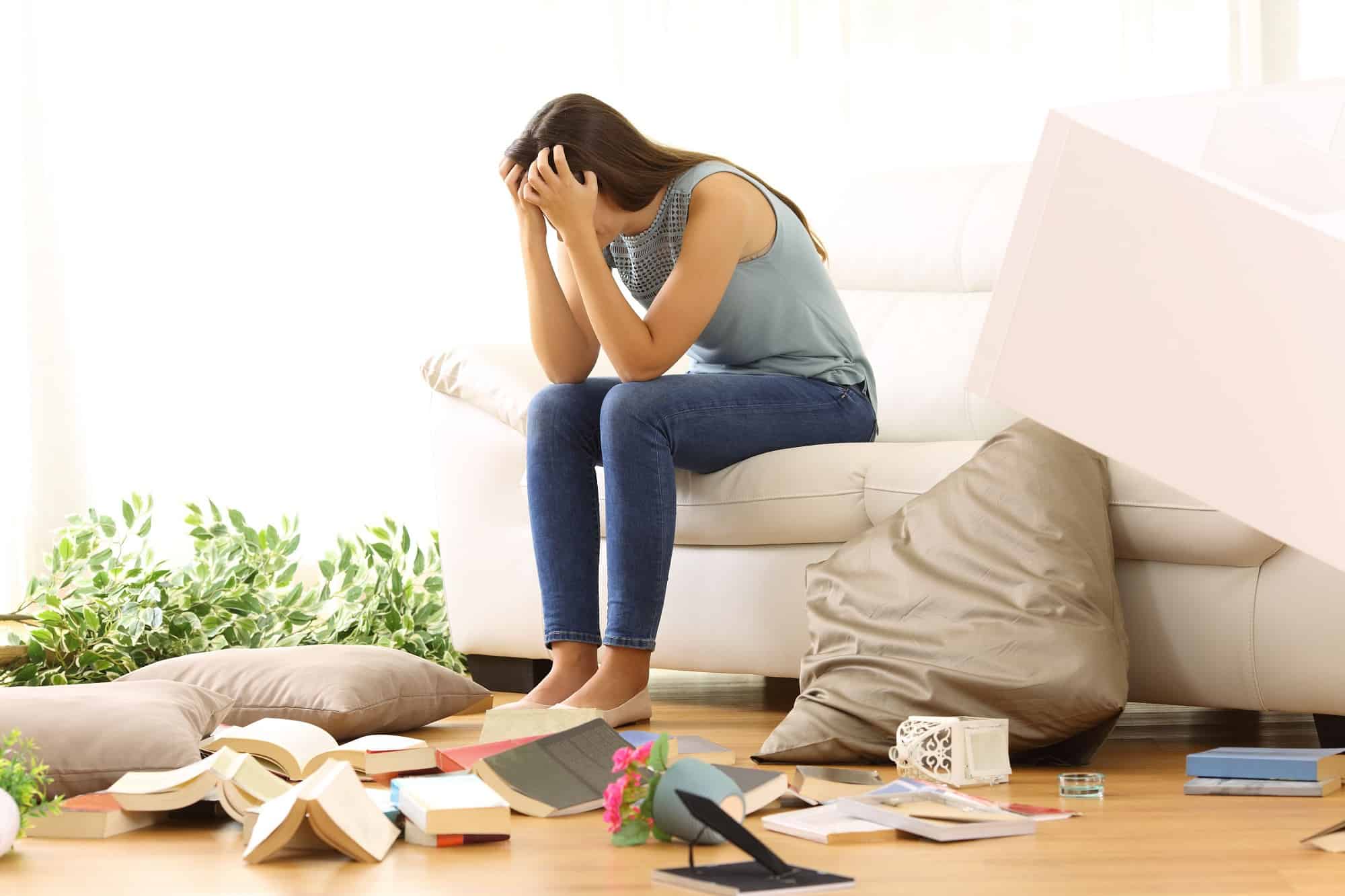 Woman stressed out with clutter around her