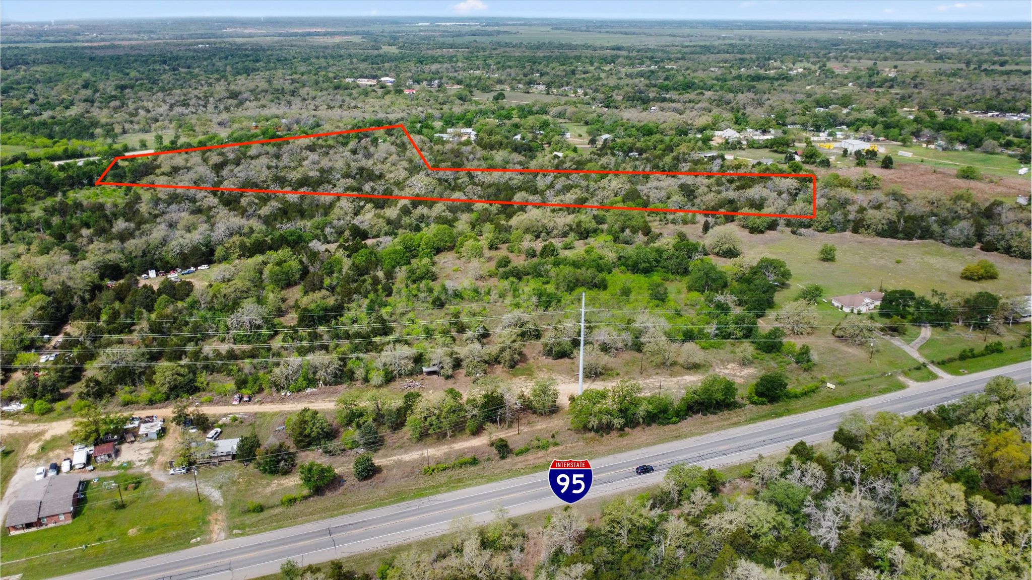 Unrestricted 6.5 Acres in Bastrop — 0 B J Mayes Rd, Bastrop, TX header image.