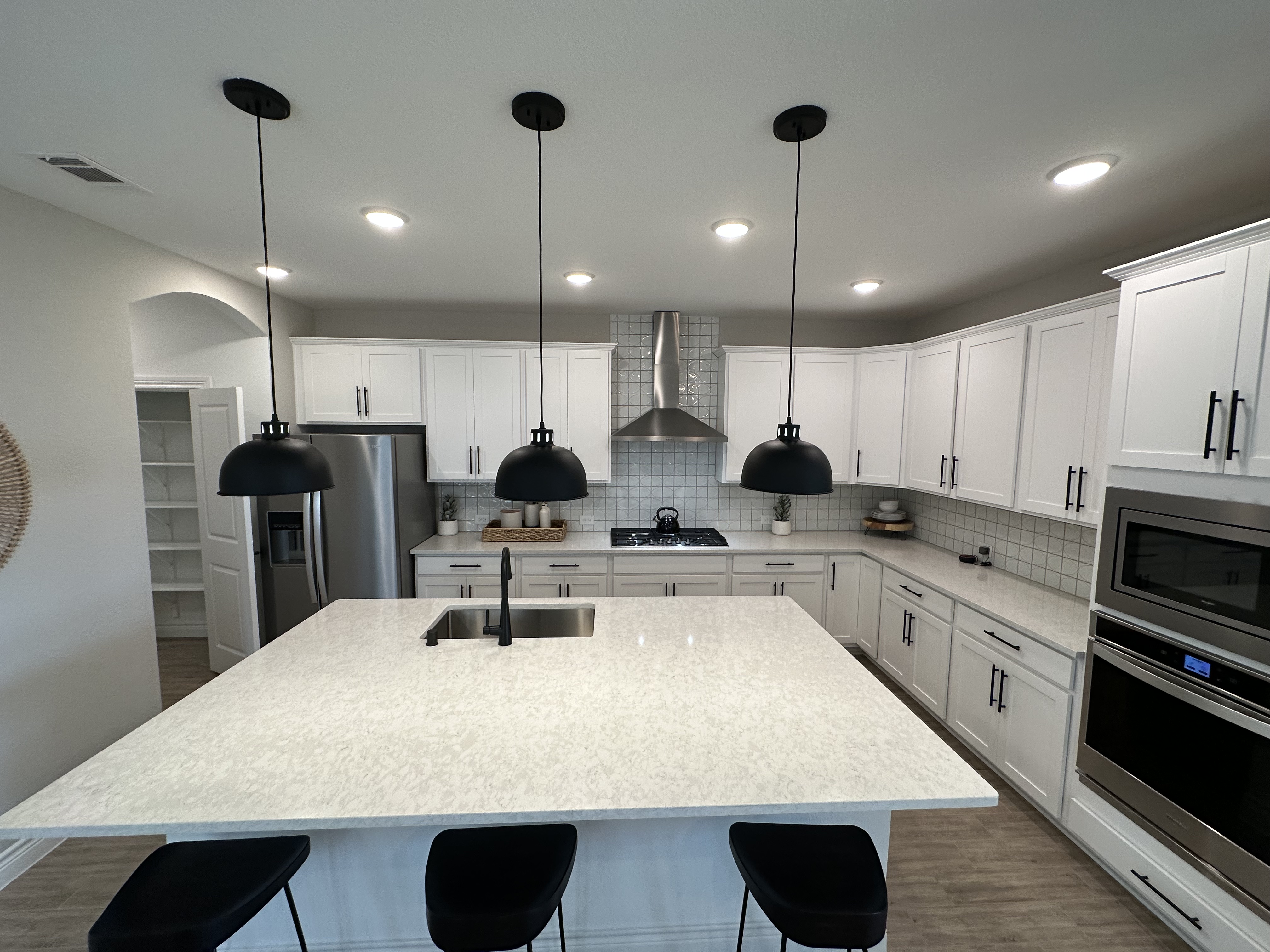 A buyer touring a newly constructed home in a Katy, Texas community.