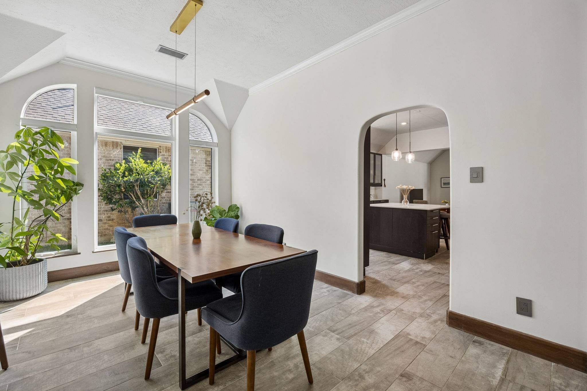 Price tag and home-repair checklist representing two strategies for a slow Katy, TX listing.
