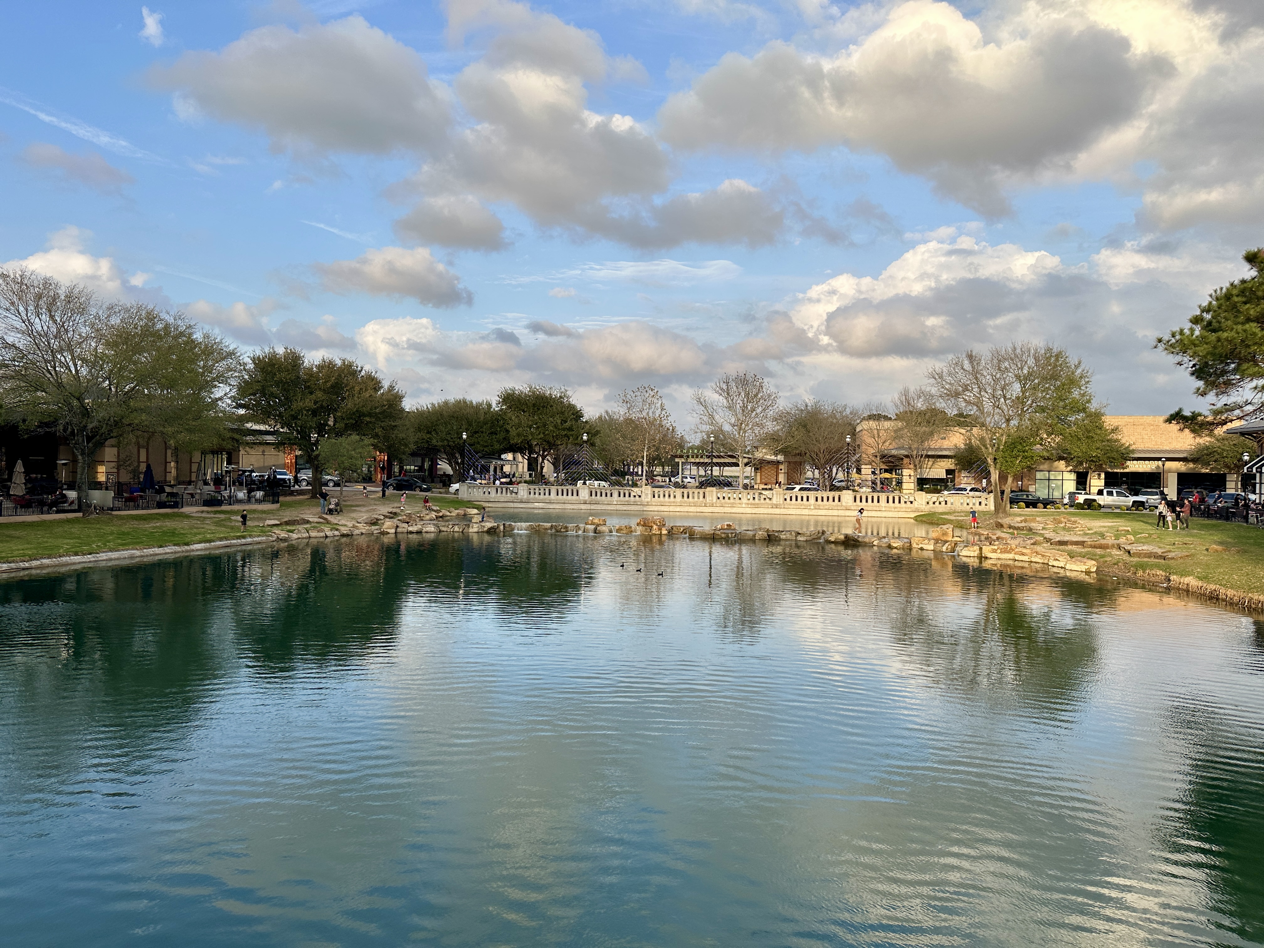 Shops and restaurants at LaCenterra in Katy TX with Central Green
