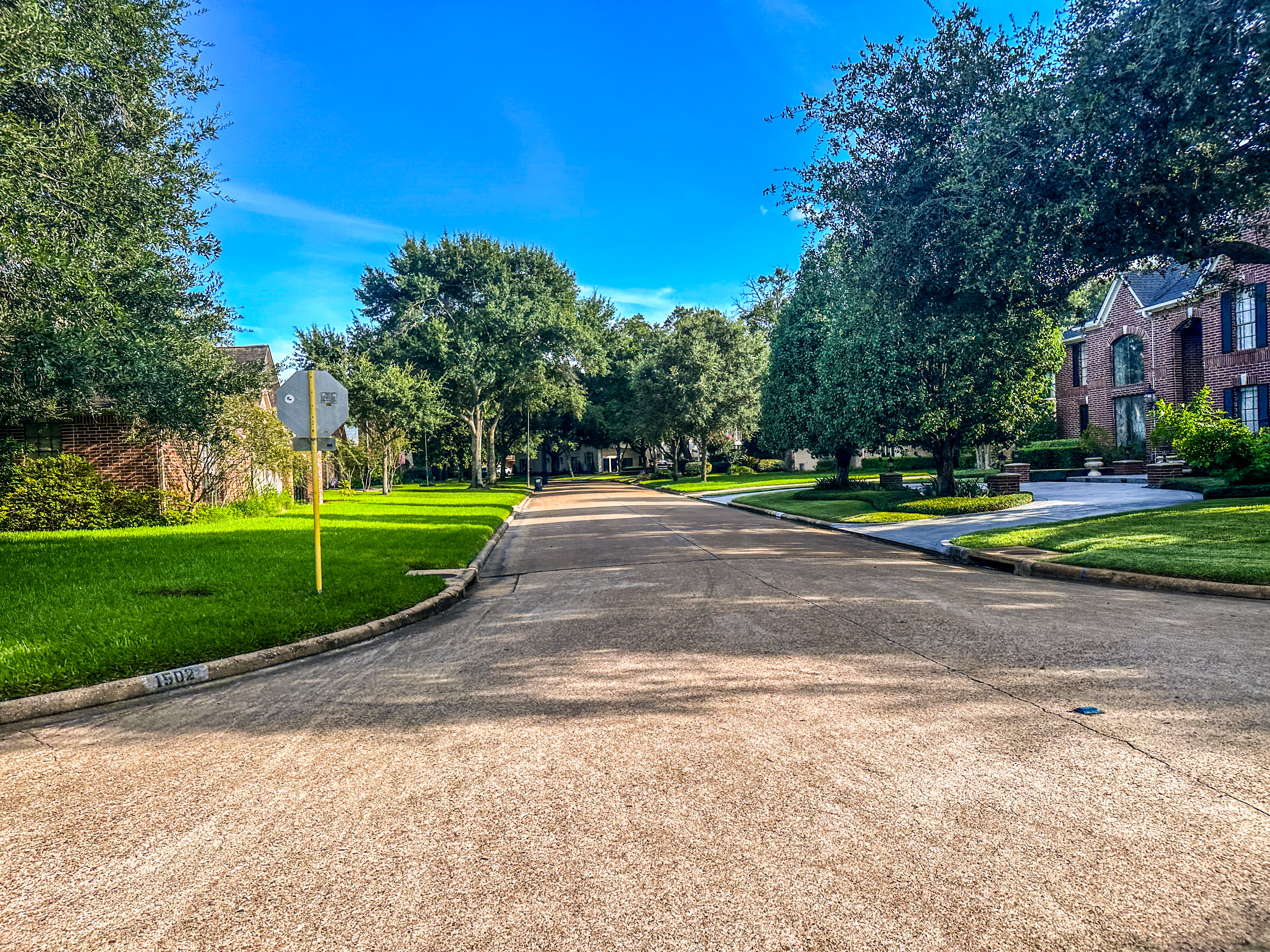 An established resale home with mature landscaping in Katy, Texas.