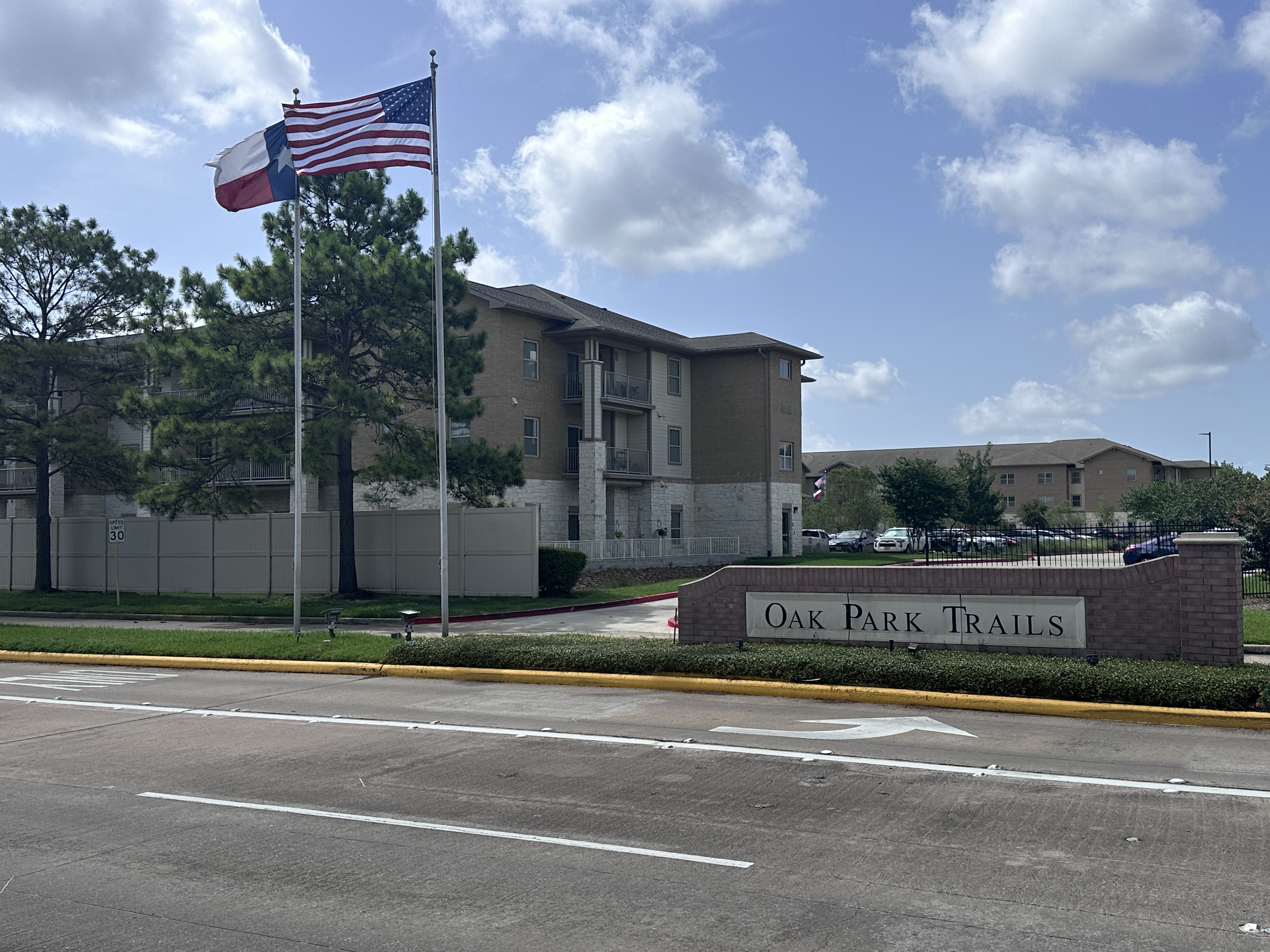 Original photo of a neighborhood entrance in Katy, Texas illustrating the differences between MUD taxes and HOA fees.