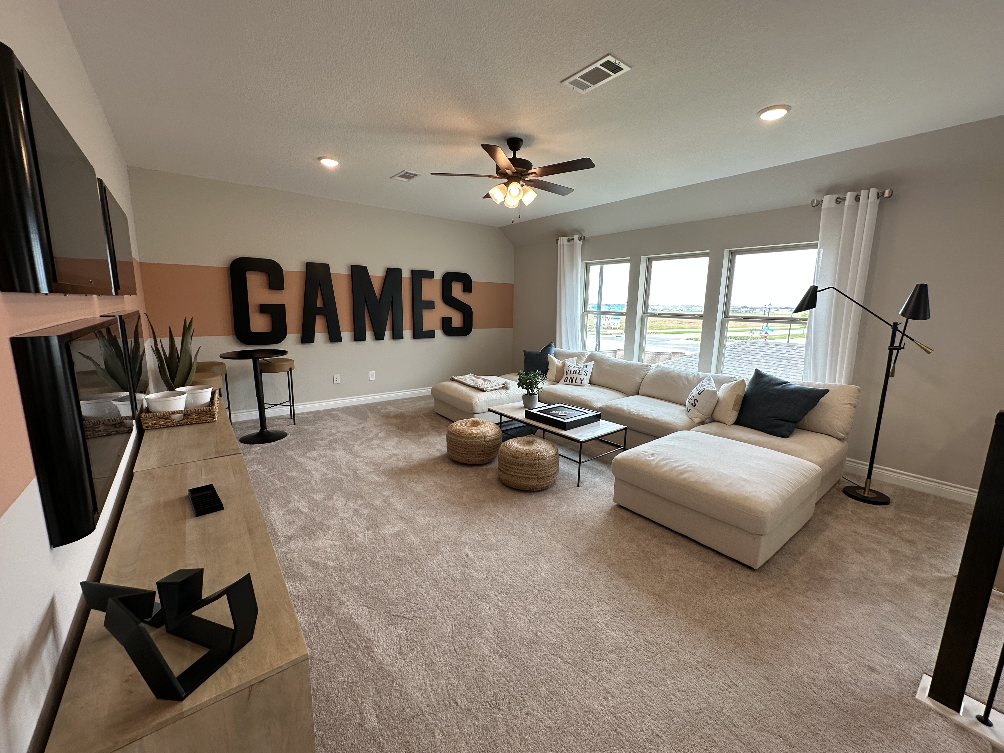 A newly constructed home and an established resale home in Katy, Texas, illustrating two common home-buying options.