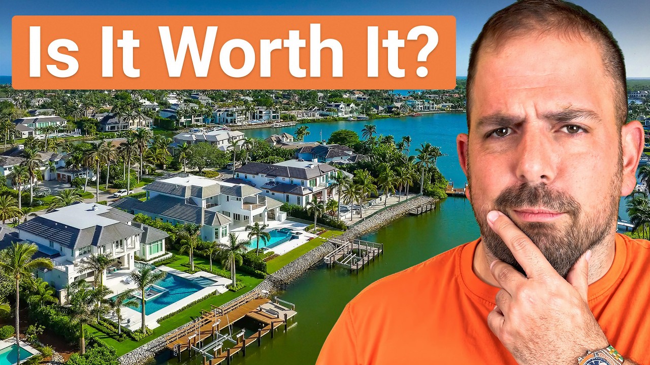 John Garuti in an orange shirt poses thoughtfully in front of a waterfront neighborhood with luxury homes, palm trees, and private docks, with the text “Is It Worth It?” displayed at the top.