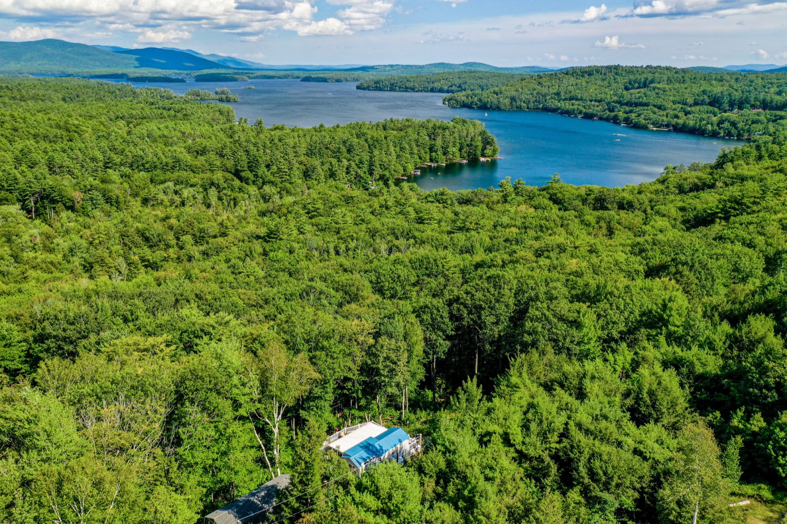 Aerial view of a Squam Lake cove in summer