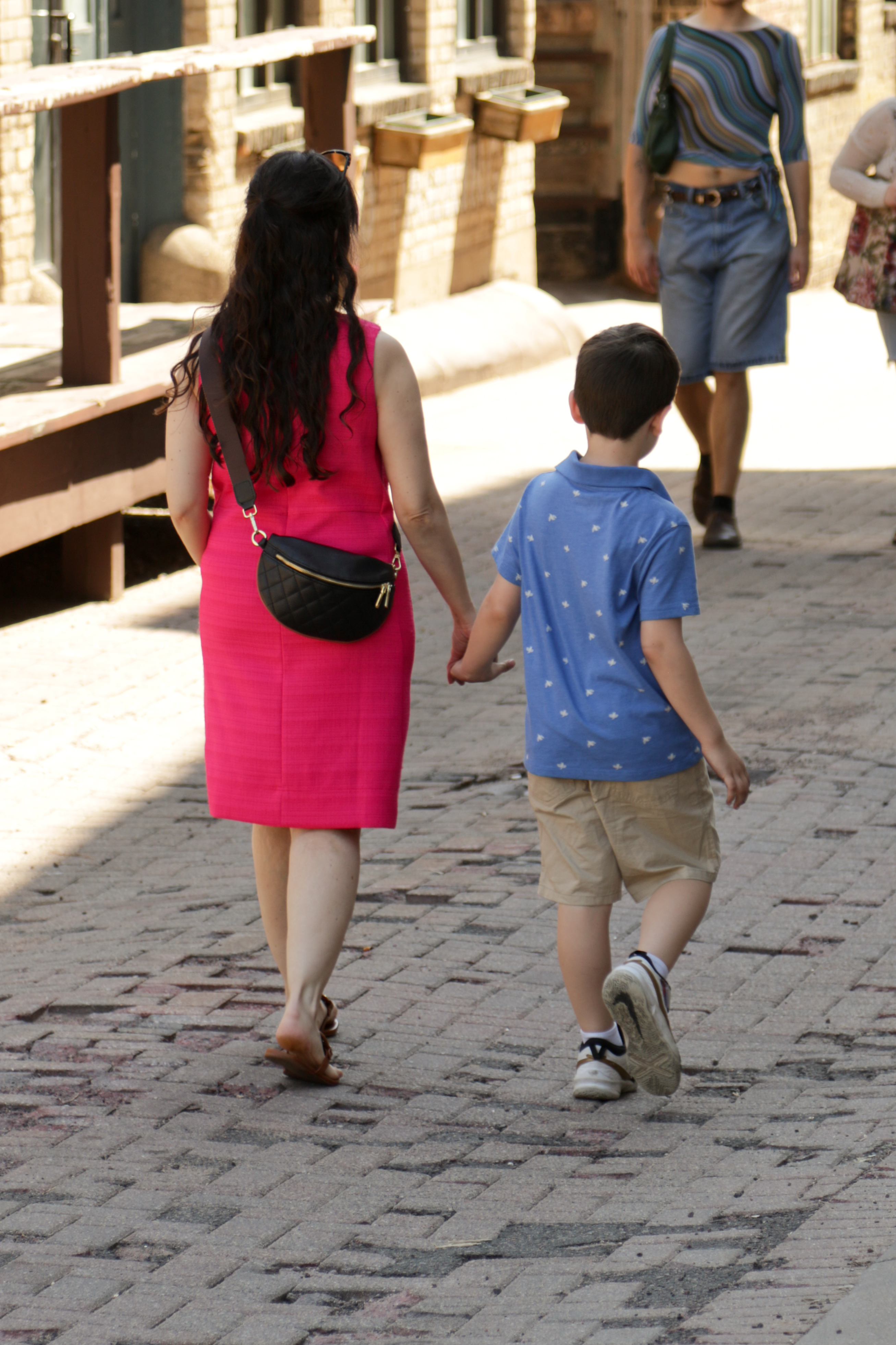 Negin walking with her son