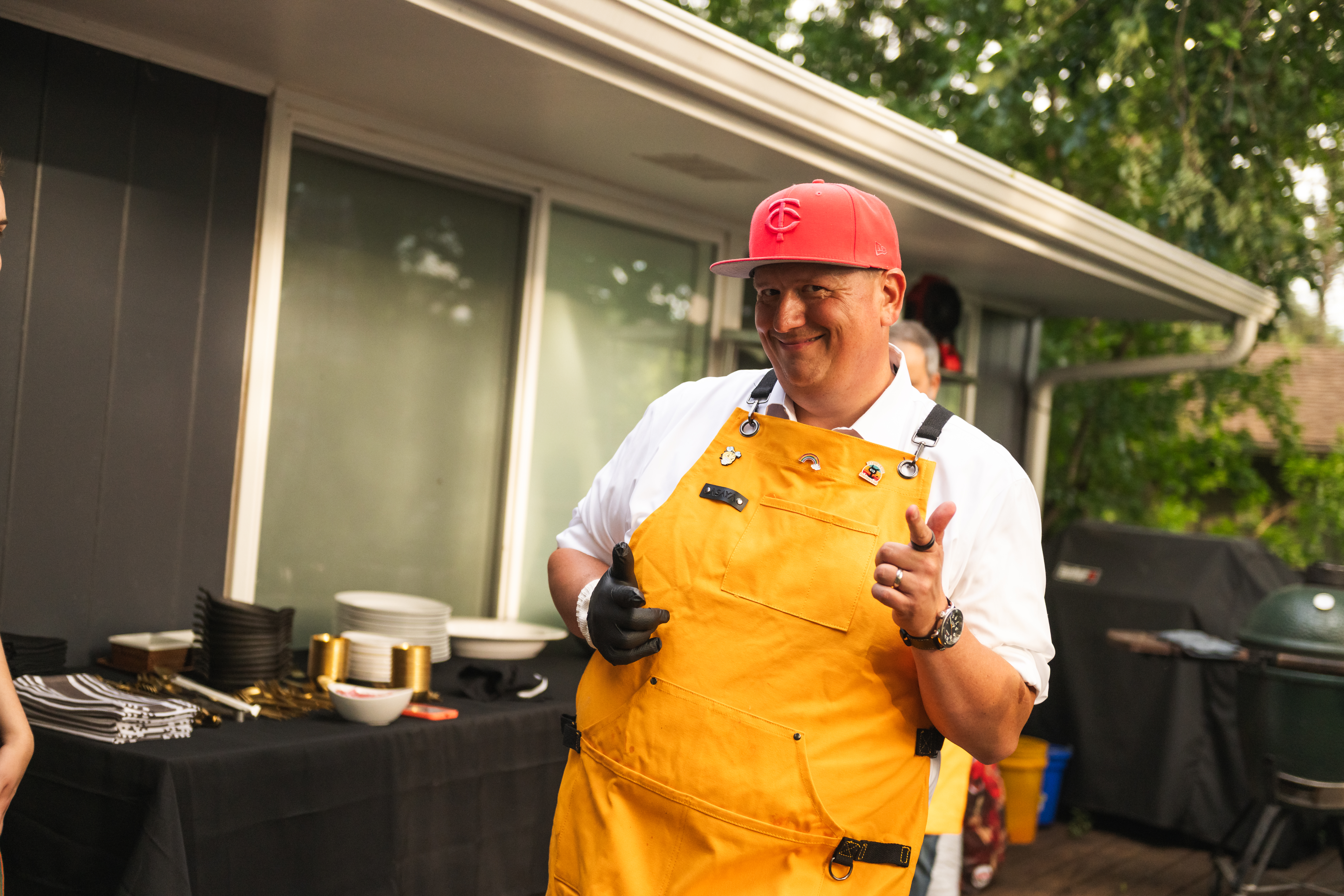 William cooking outdoor on the backyard deck