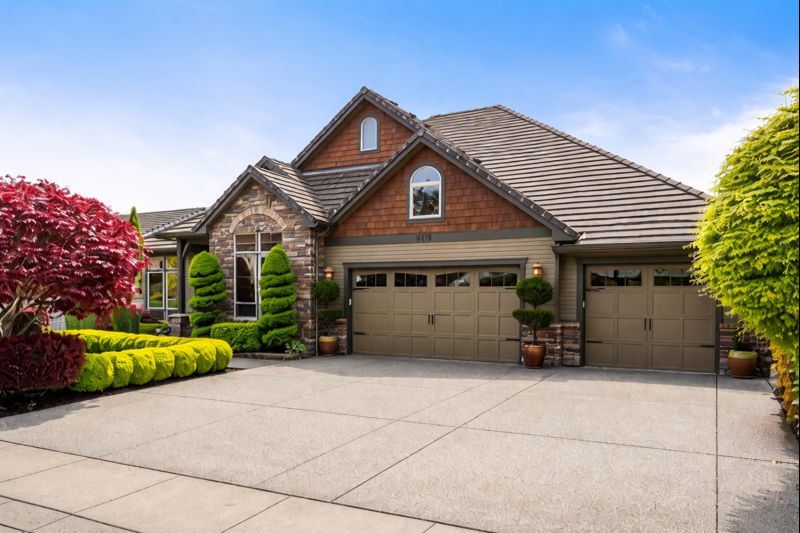 Residential homes in West Salem Oregon with mature trees and hillside views