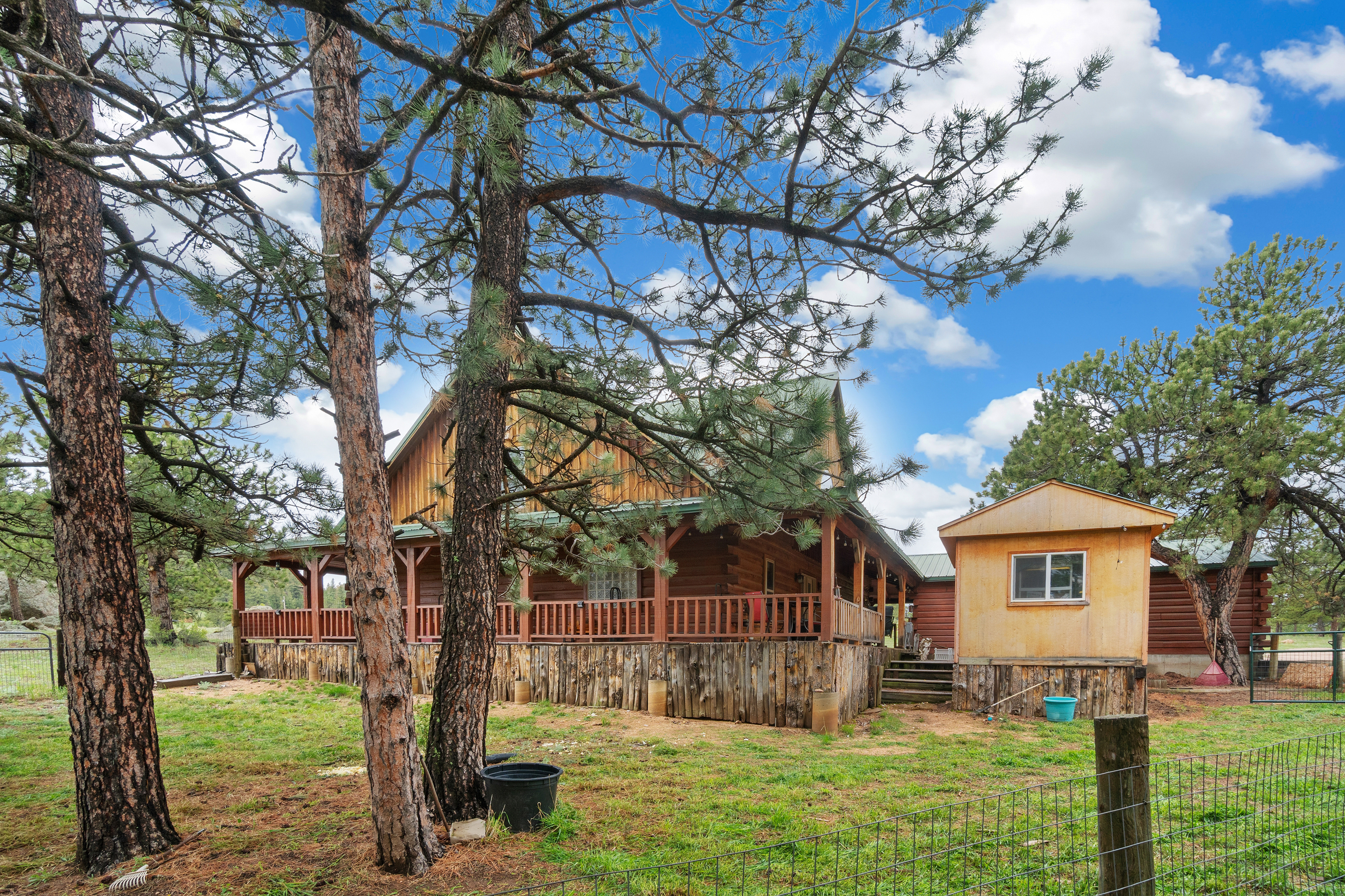 Custom sinker cypress log home at 1084 Iron Mountain Drive near Red Feather Lakes Colorado.
