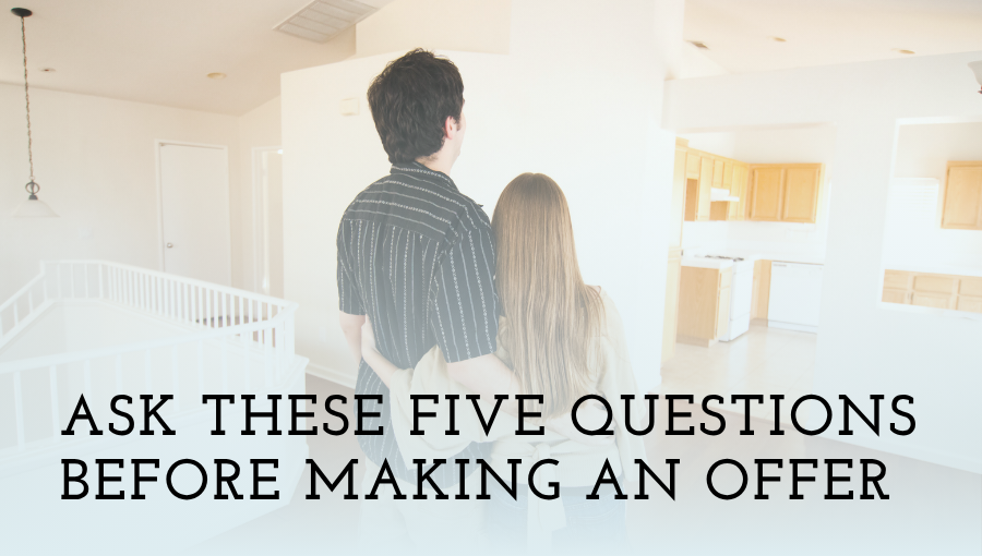 Two people looking at a home for sale