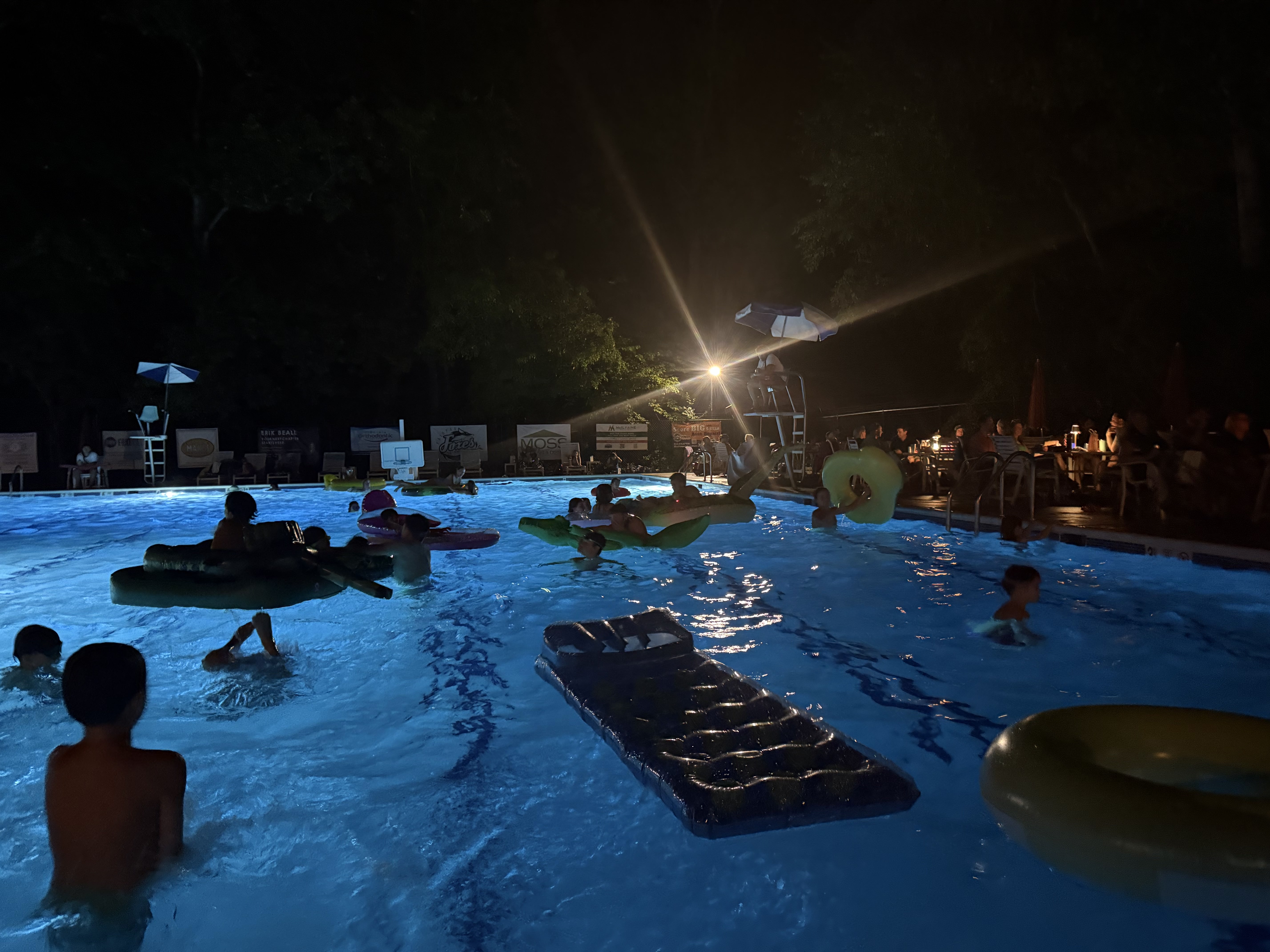 Families enjoying the Dive-In Movie Night at Camelot Pool in Annandale