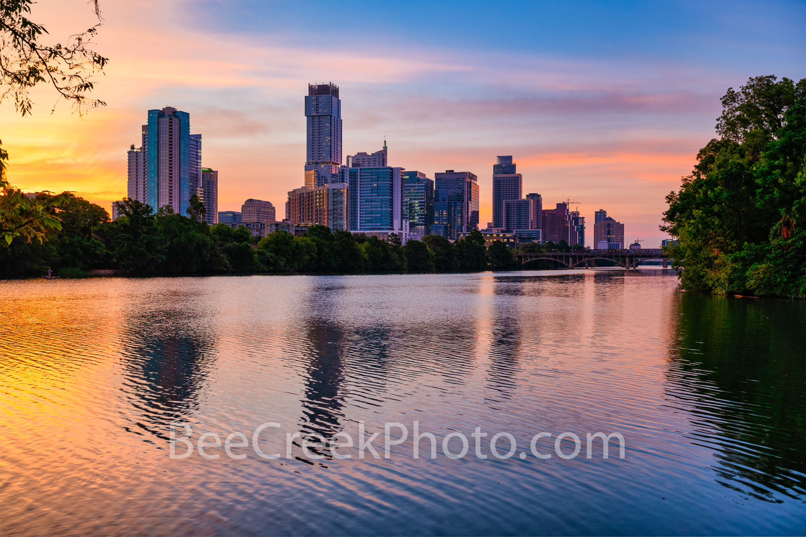 Runner enjoying sunrise miles along Lady Bird Lake in Austin, Texas, with skyline views — highlighting Austin’s most runner-friendly neighborhoods.