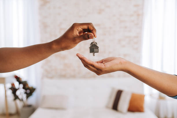 First-time homebuyers receiving keys to a new house in Austin, Texas representing entry into the competitive 2026 housing market