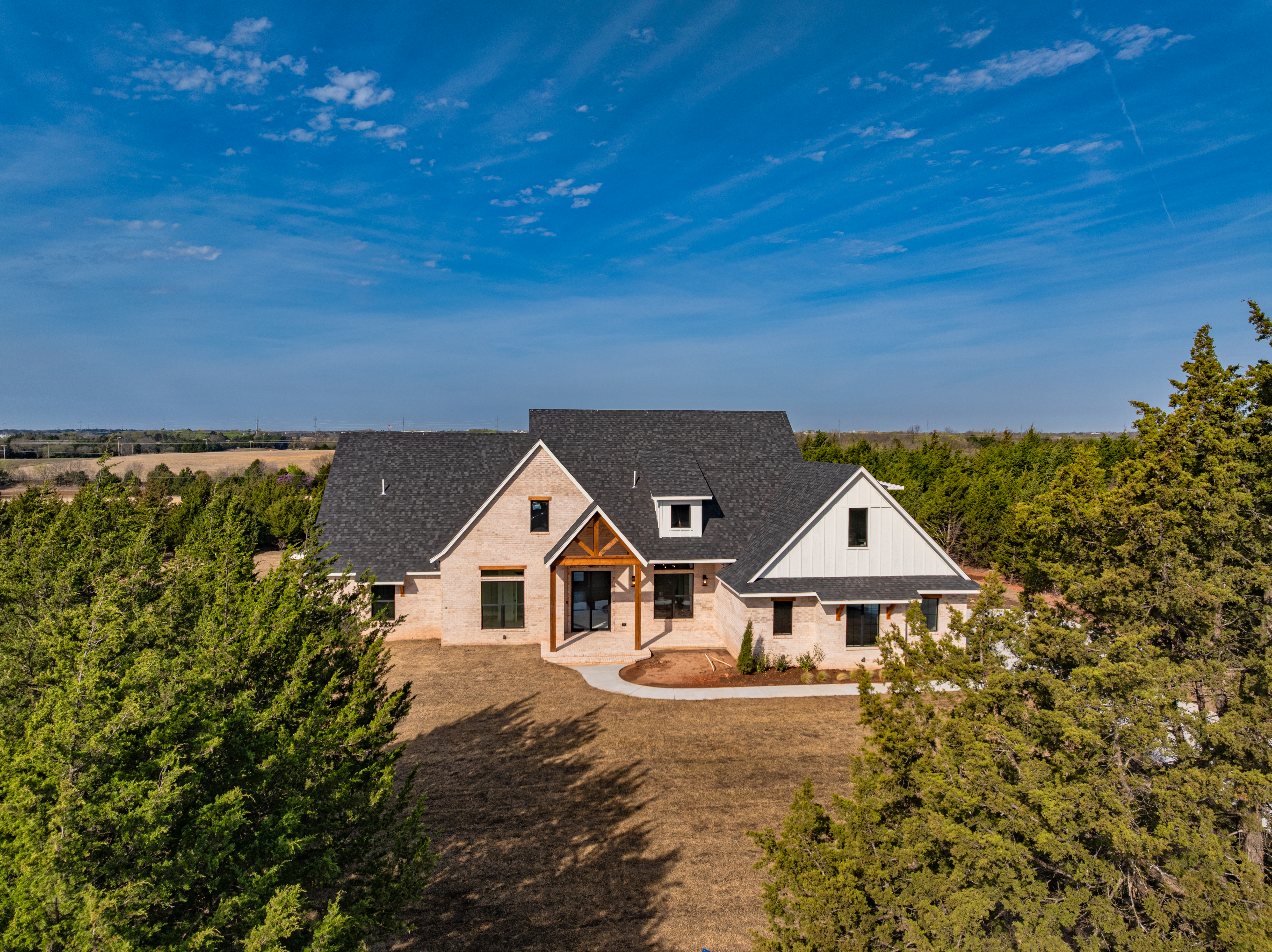 Luxury modern-farmhouse on tree-lined acreage