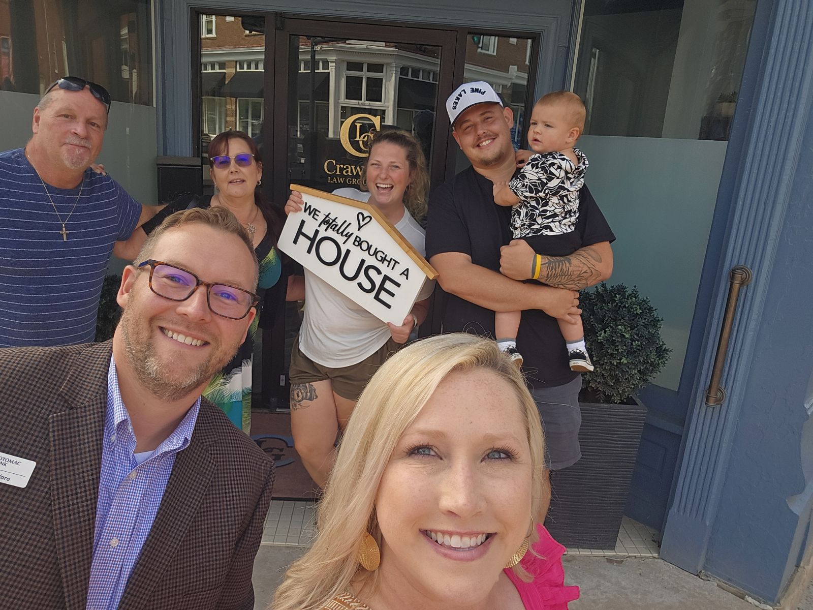 Buyers and sellers celebrating their real estate closing with Kable Team agent Lauryn Carper and lender Adam Ware of Potomac Bank