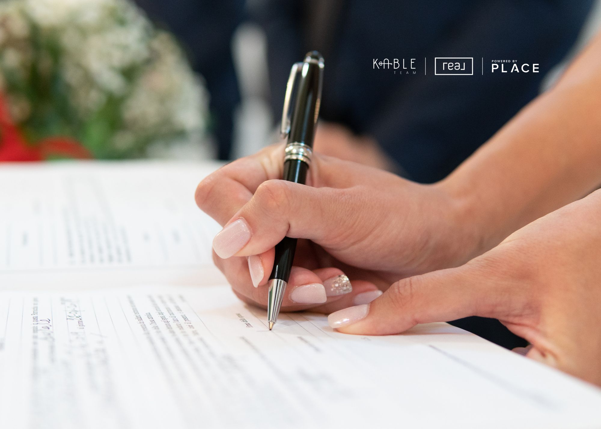 Signing real estate documents for the sale of an inherited home in West Virginia with The Kable Team.