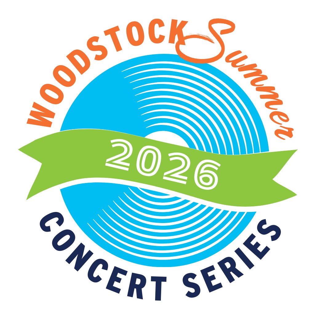 Downtown Woodstock Main Street before a summer concert, with shops and restaurants near the amphitheater.