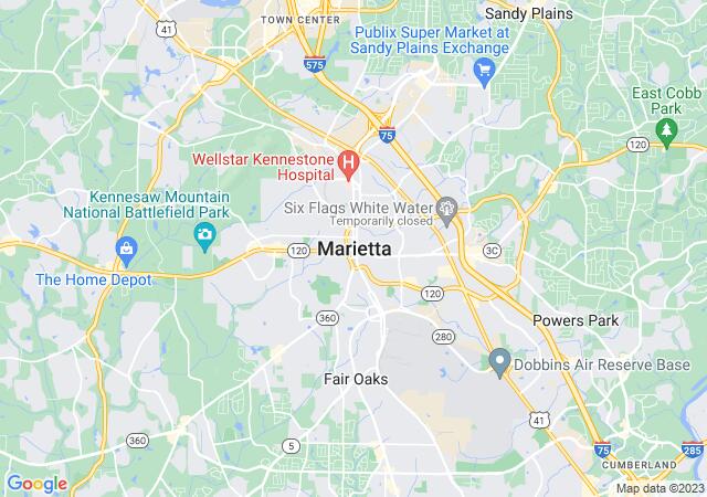 A sunny afternoon in Marietta Square with families walking, live music, and boutique shops.