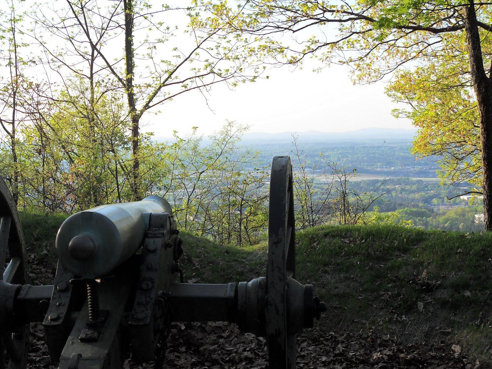 A scenic view of Kennesaw Mountain National Battlefield Park with blue skies and lush greenery, representing the historic charm and natural beauty of Kennesaw, GA.