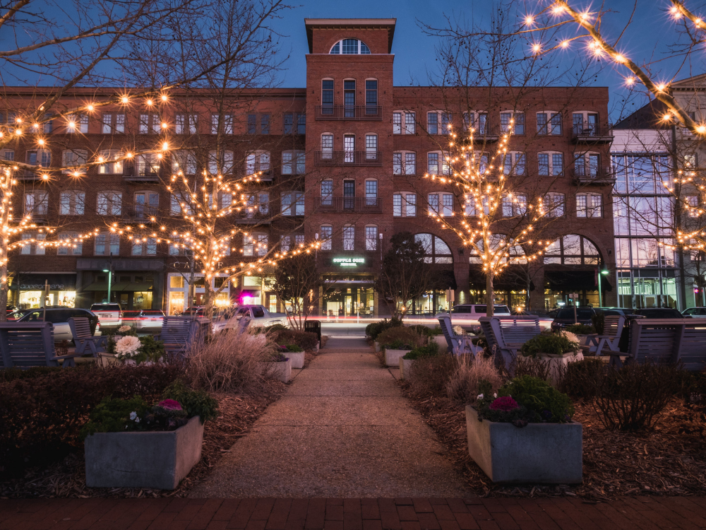 Holiday decorations and warm community atmosphere in Downtown Woodstock, Georgia, celebrating the season while highlighting local real estate service and community connection.