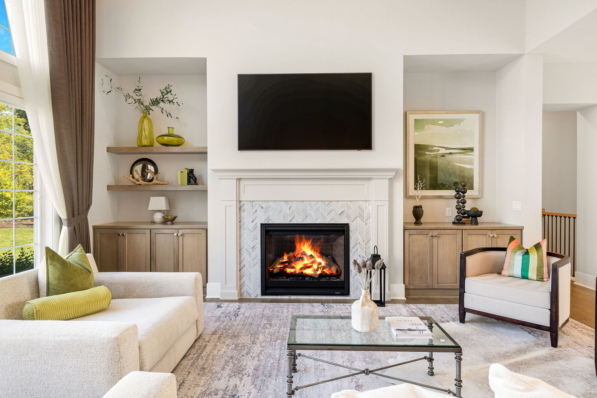 Contemporary living room with fire burning in fireplace