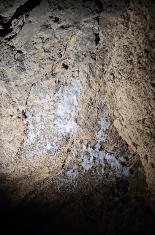 Close-up of white crystalline mineral formations inside abandoned sandstone mine near Cedar City Utah