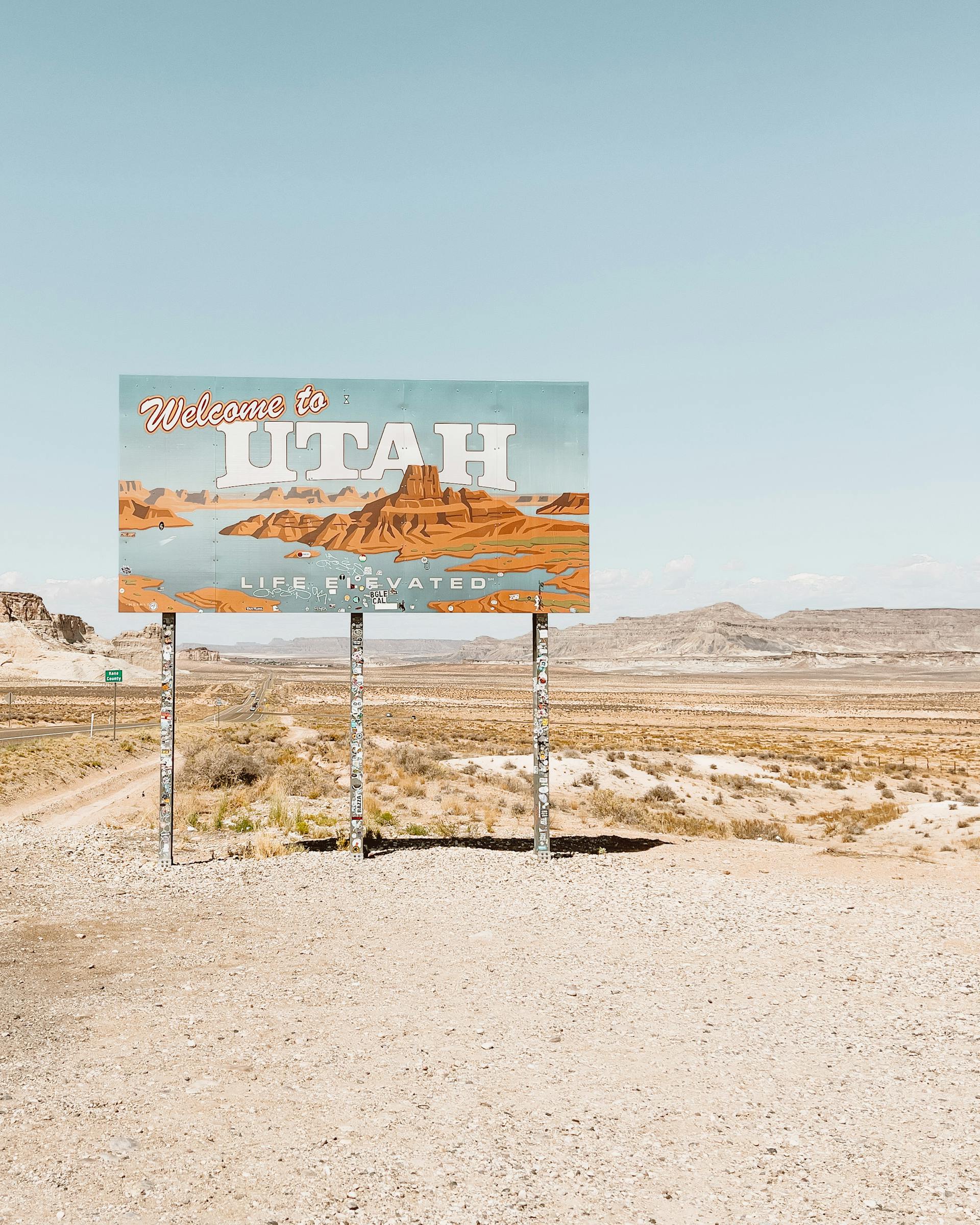 Photo by Ryan Hiebendahl: https://www.pexels.com/photo/a-welcome-to-utah-signboard-on-the-roadside-9576611/