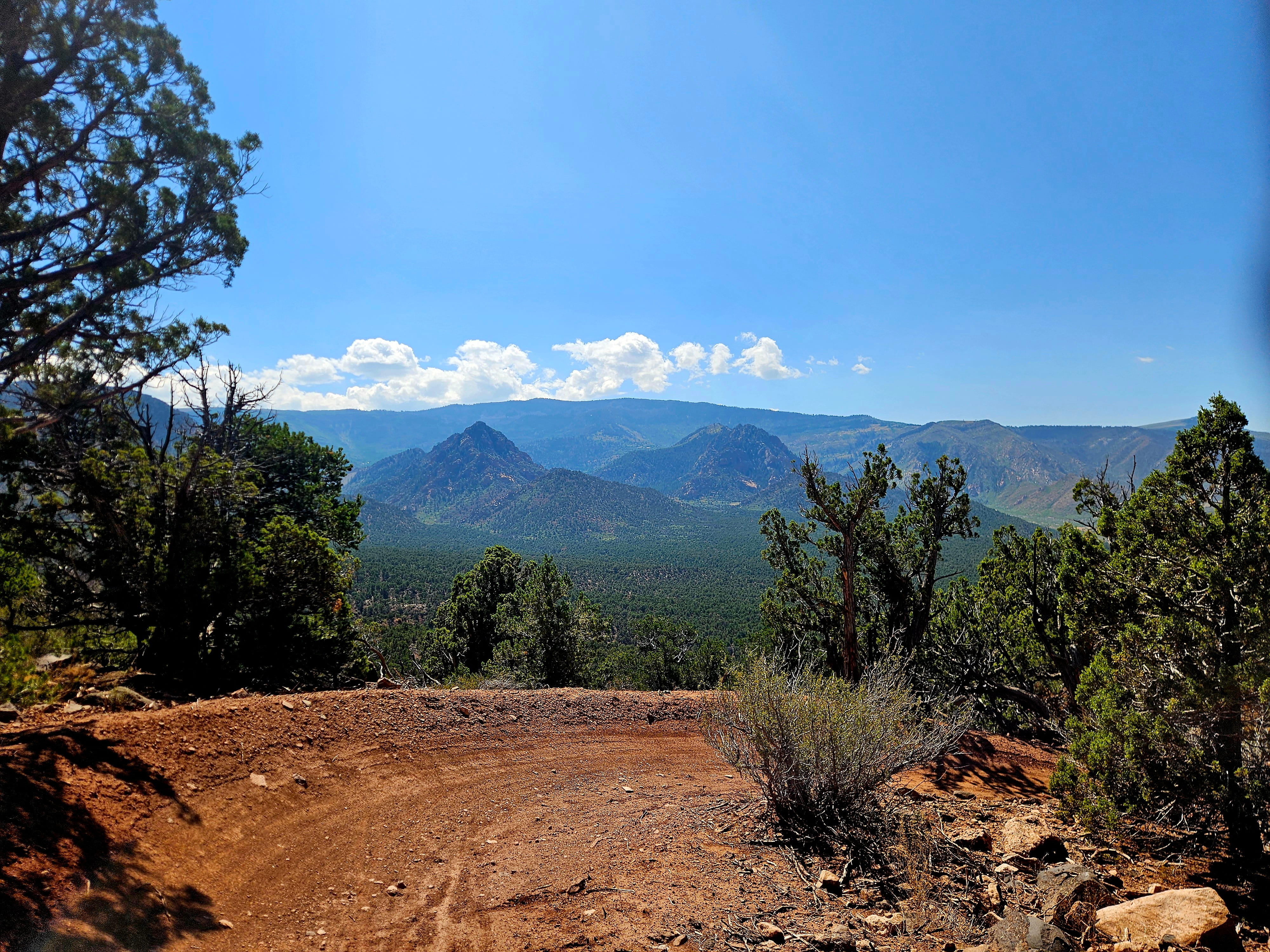 Scenic red rock and juniper-covered hillside along Iron Hills mountain biking trails near Cedar City Utah